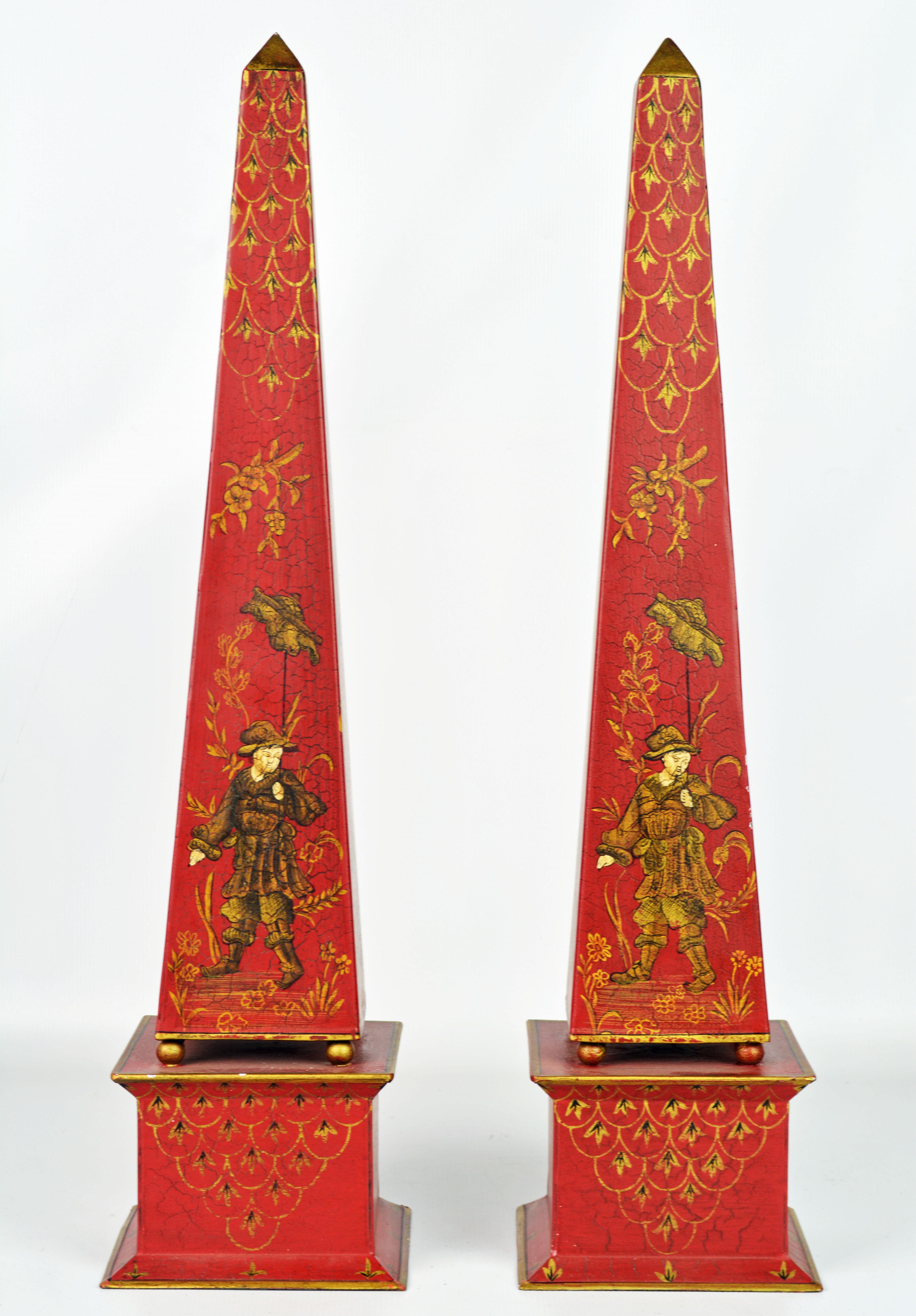 Standing 22 inches tall and painted in the Chinese taste on a Venetian red background these obelisks make a fashionable statement.