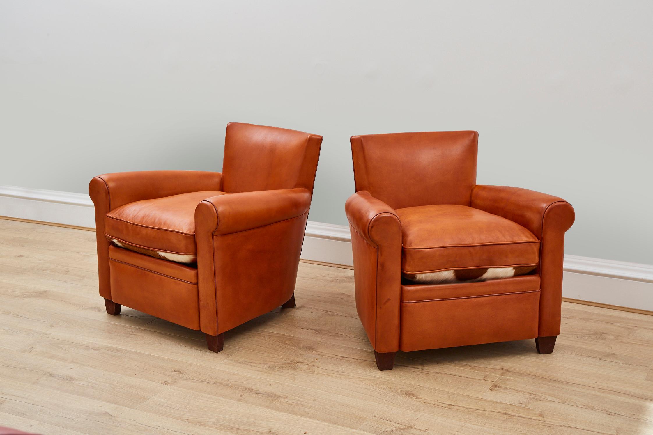 Modern Pair of Tan Leather Club Chair with Cow Skin Cushions