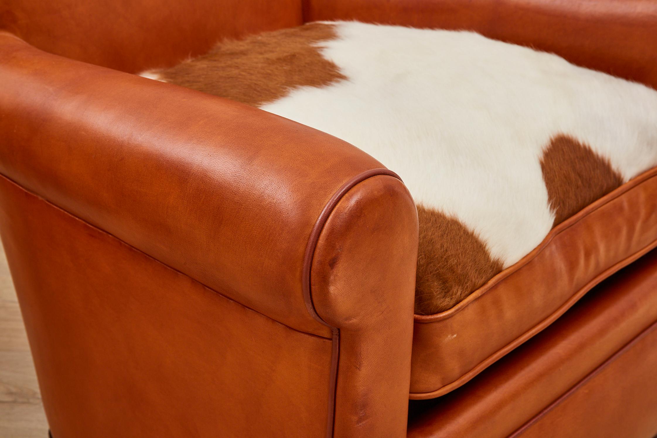 Contemporary Pair of Tan Leather Club Chair with Cow Skin Cushions