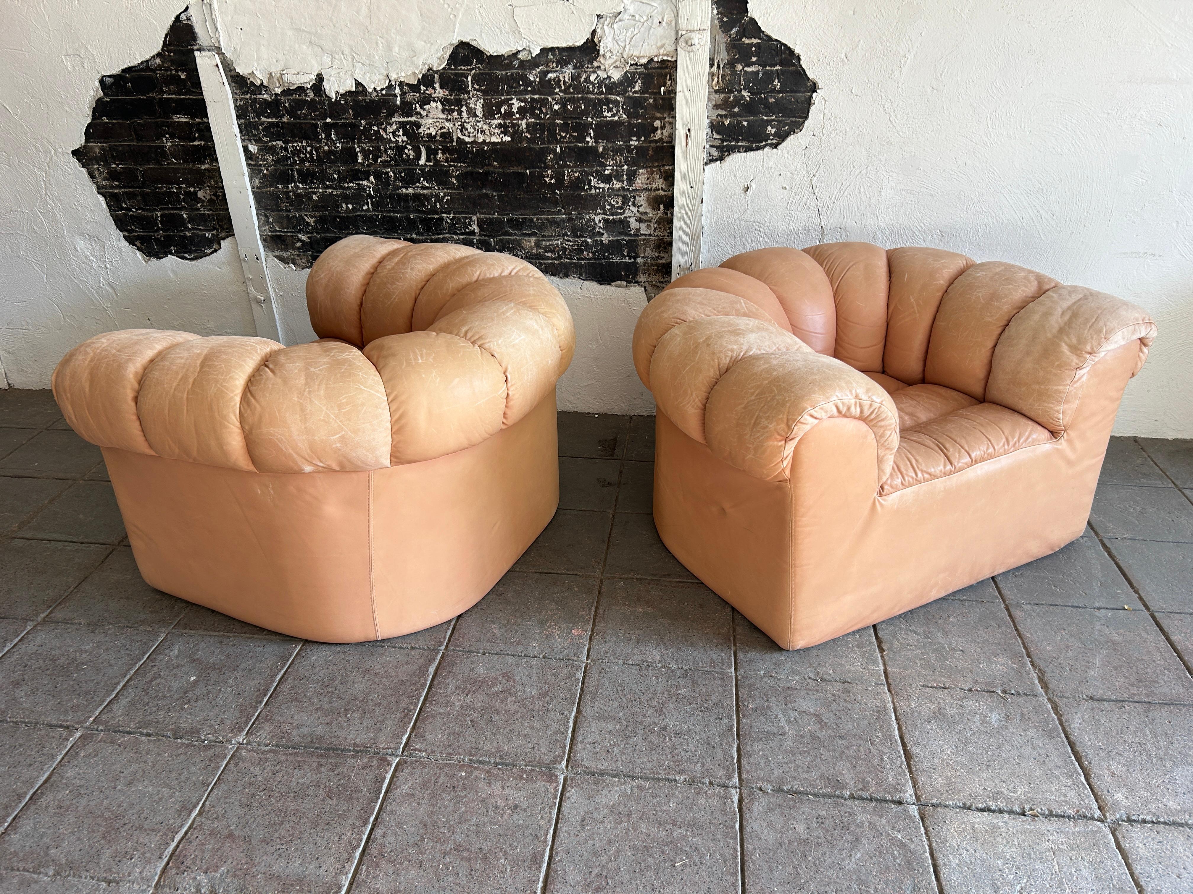 Leather Pair of tan leather Dutch croissant puffy low lounge chairs
