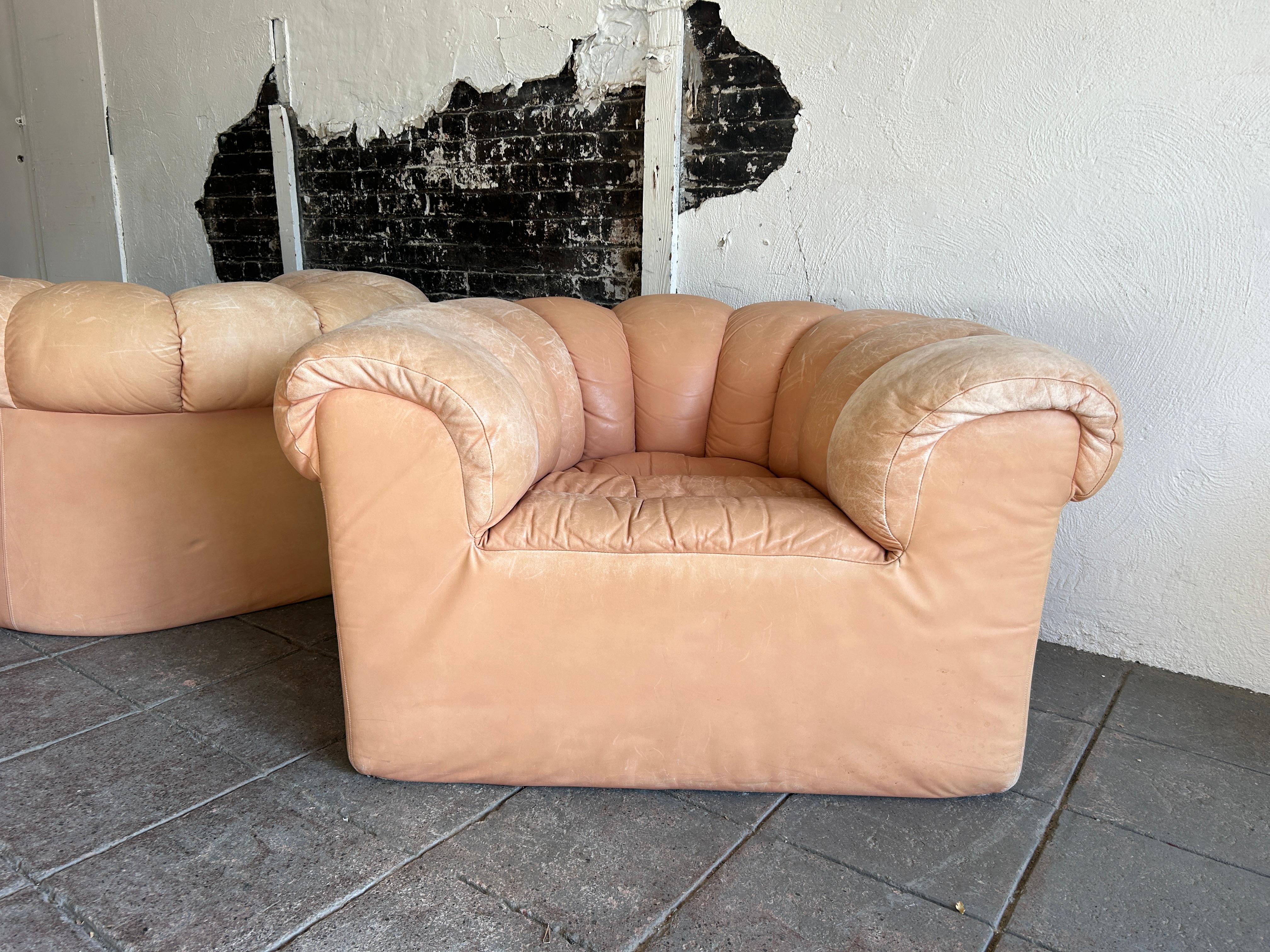 Pair of tan leather Dutch croissant puffy low lounge chairs 1
