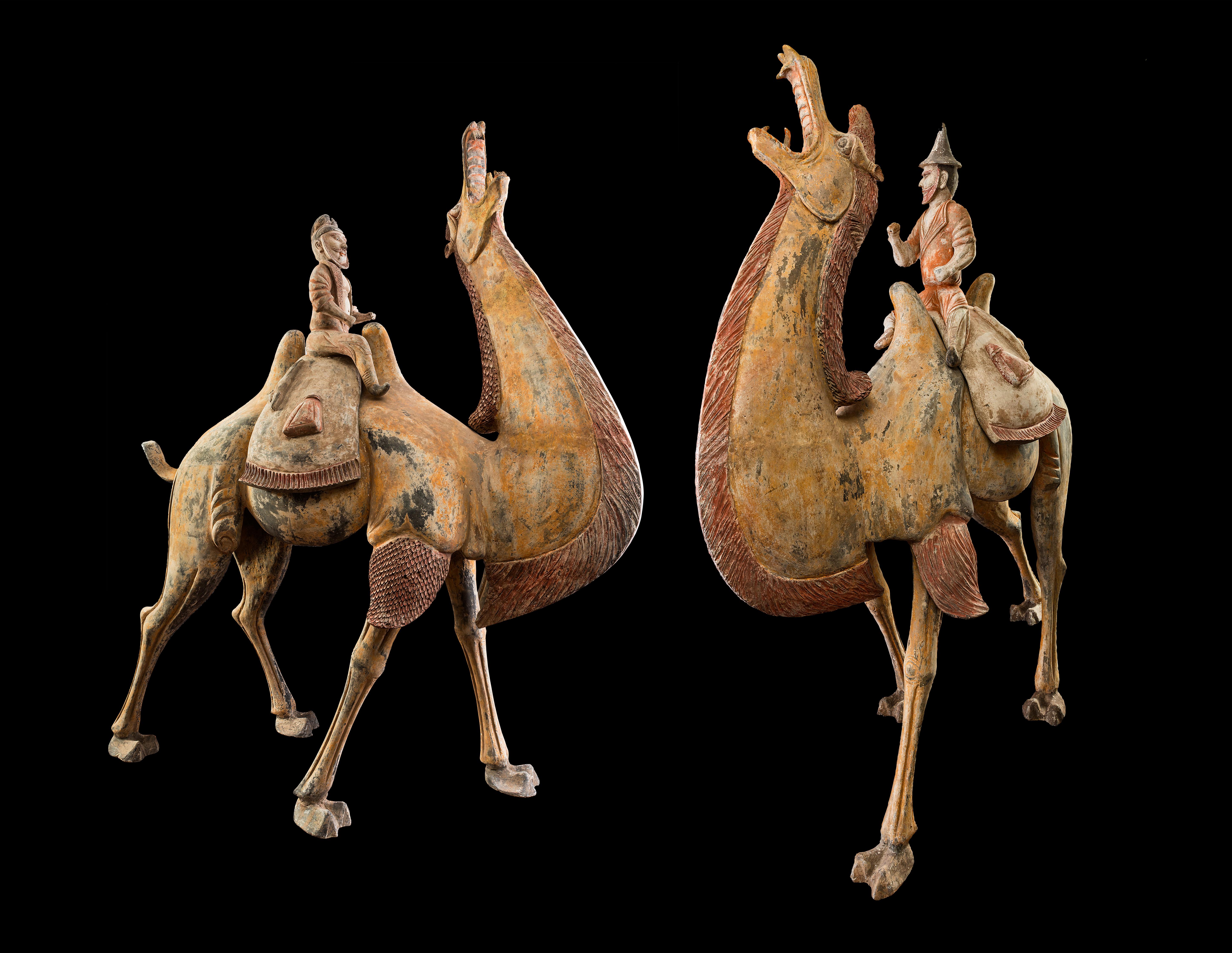 Hand-Painted A Pair of Tang Dynasty Chinese Terracotta Bactrian Camels with Riders For Sale