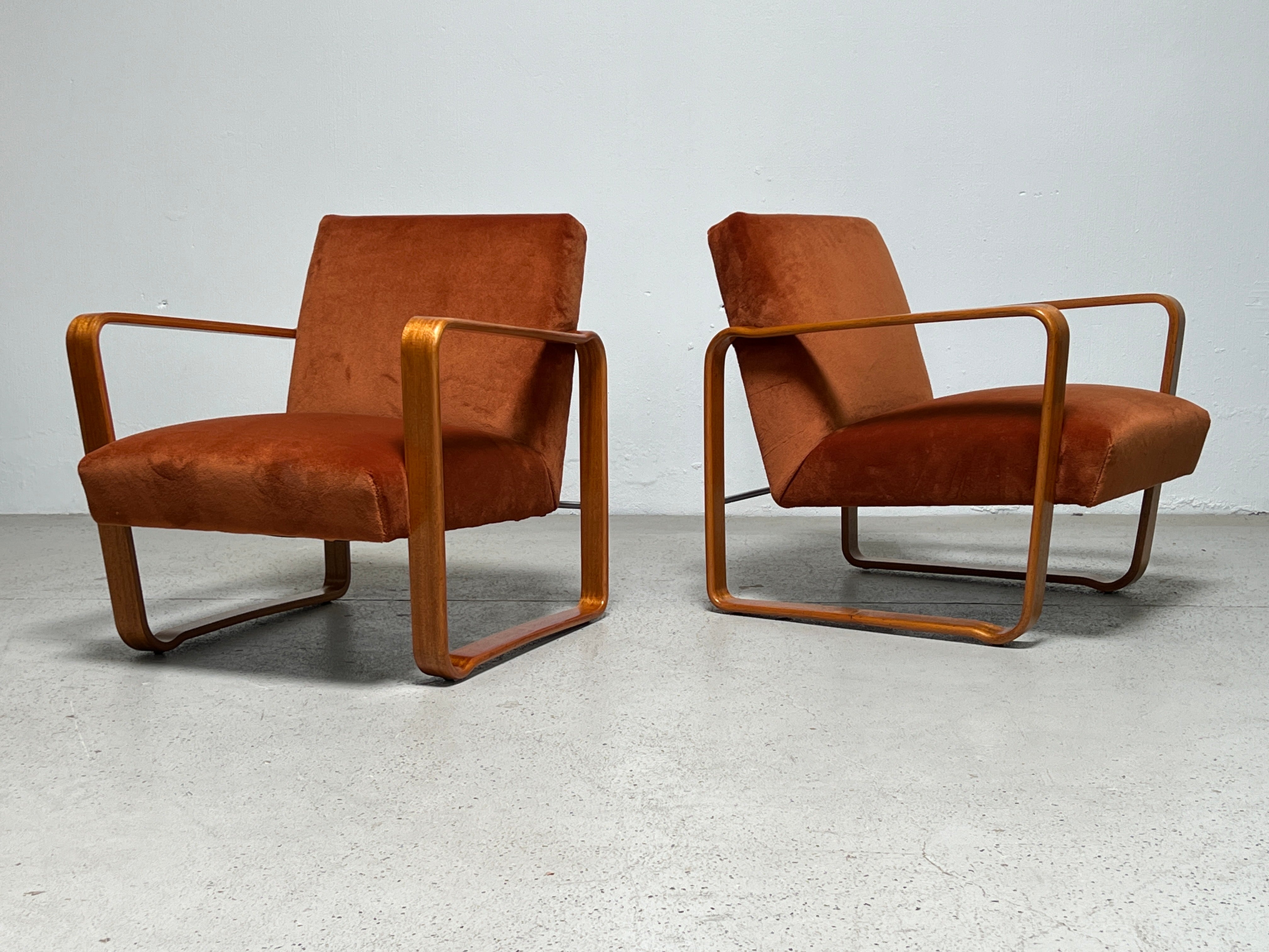 A rare pair of mahogany and mohair tank lounge chairs designed by Edward Wormley for Dunbar.