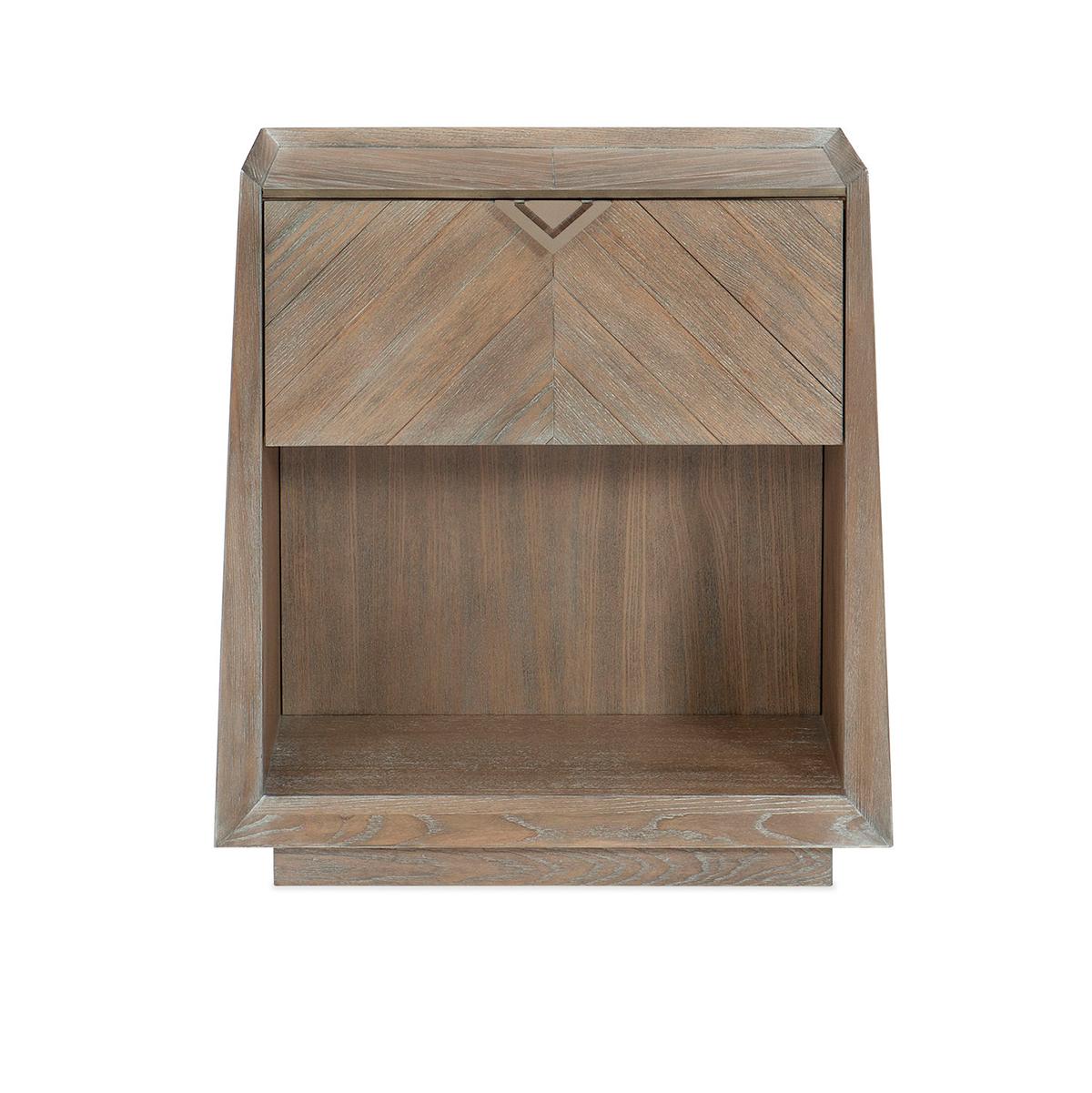 With a simple, slightly tapered silhouette brought to life with exquisitely matched directional woodgrain veneers in a one-of-a-kind chevron pattern.

A casual finish of Ash Driftwood highlights the beauty of its stunning veneers. This nightstand’s