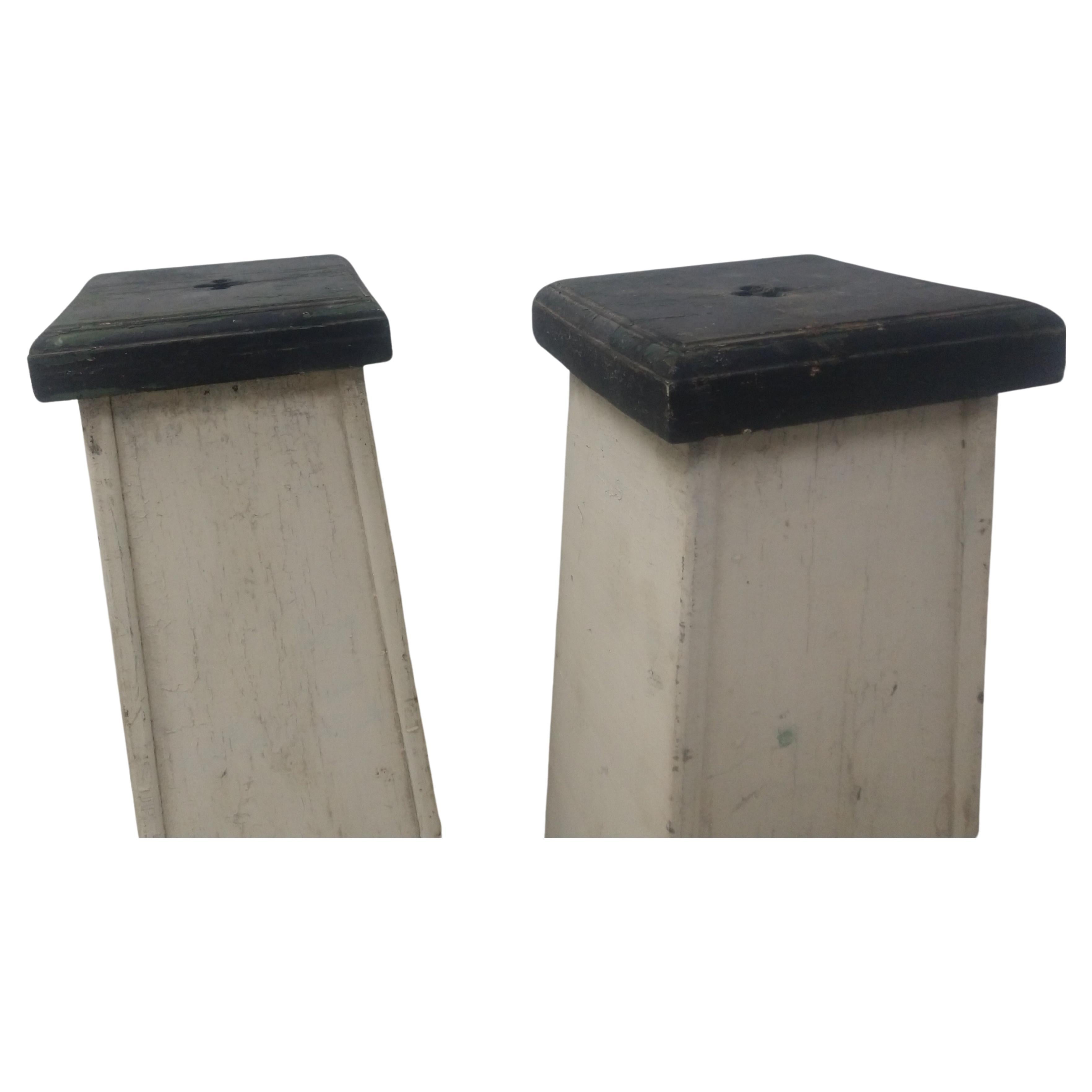 Tall and sturdy with arched cutouts at the feet giving them an architectural look combined with the old paint a lot of patina. Clover type cutouts on the top board which is 9.75 x 10 to accommodate a plant or a piece of art. In excellent antique