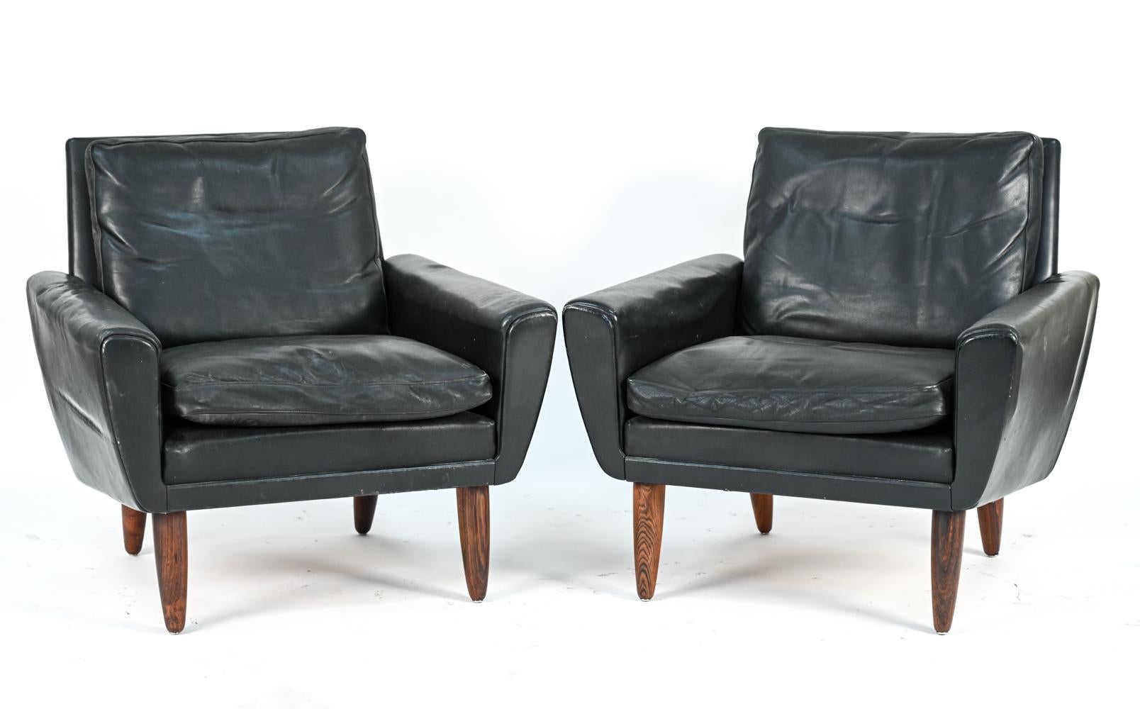 A pair of Danish mid-century lounge chairs in black leather by Tarm, c. 1950.