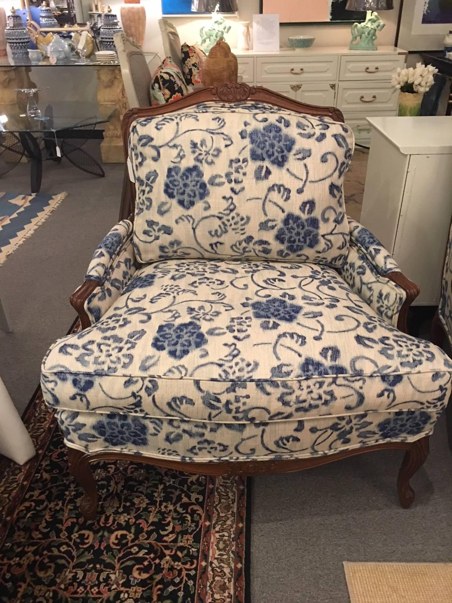 This pair of Taylor King bergere chairs is roomy, solid and comfortable and in excellent condition. Just reupholstered in a beautiful indigo and ivory woven fabric.
