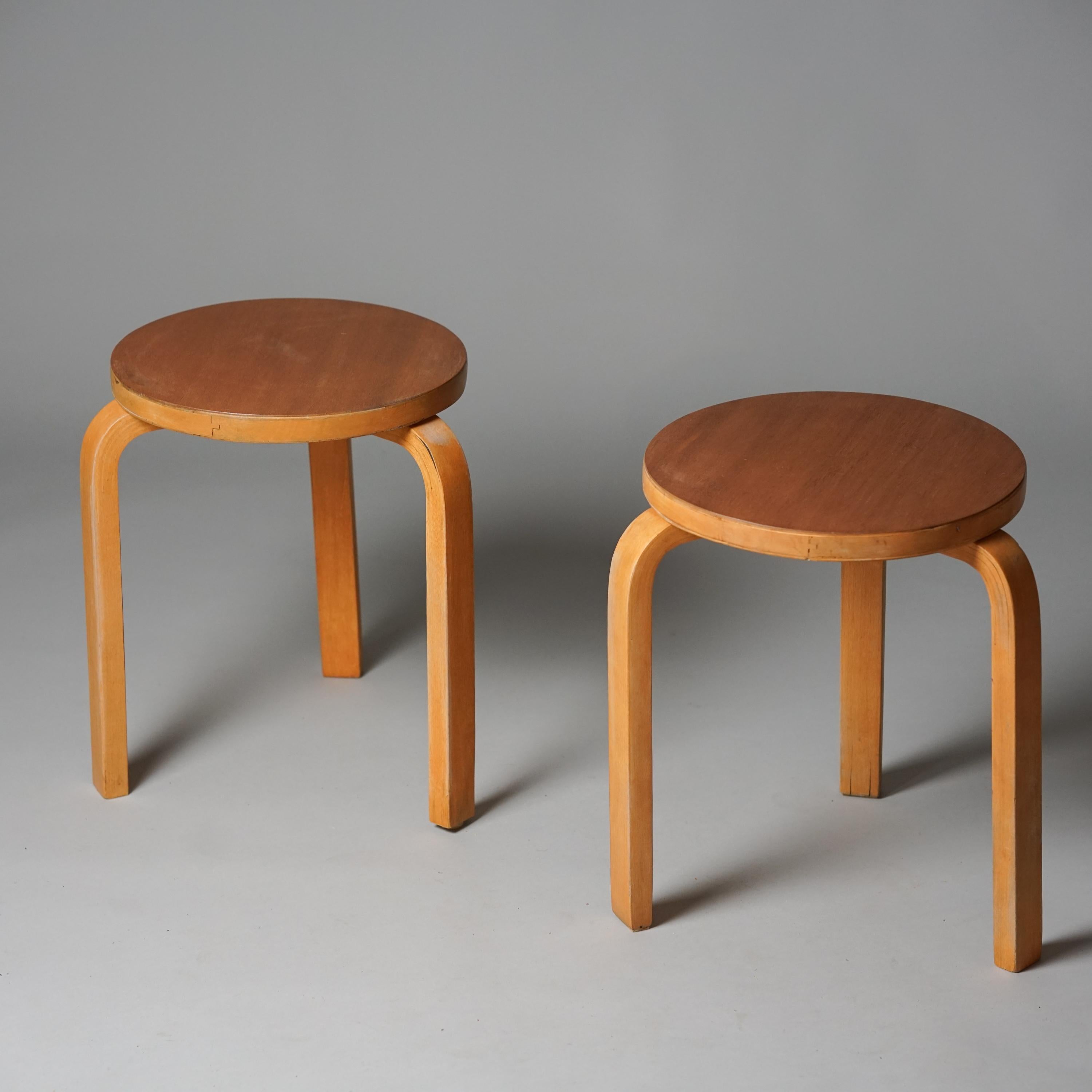 Pair of rare model 60 stools, designed by Alvar Aalto, manufactured by Oy Huonekalu- ja Rakennustyötehdas Ab, 1940s. Birch frame with teak top. Good vintage condition, patina consistent with age and use. The stools are sold as a set. 

Alvar Aalto