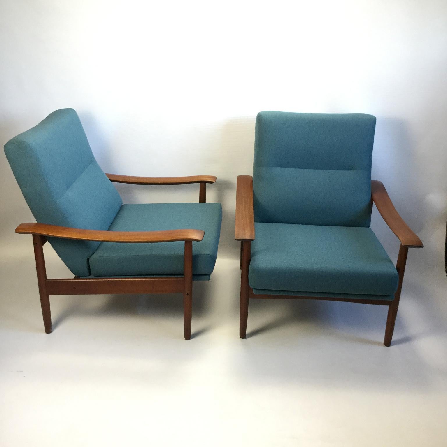 Pair of vintage solid teak armchairs by Gerard Guermonprez
Fully restored with new foams and new straps
Upholstered with blue/green mottled fabric.