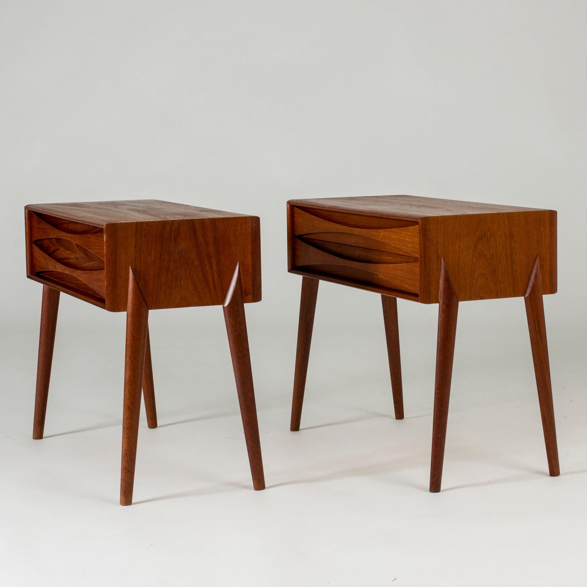 Pair of neat bedside tables by Rimbert Sandholt, made from teak. Beautifully sculpted drawer fronts, cool graphic details on the sides.