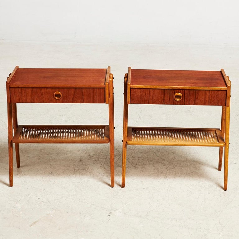Rare pair of Scandinavian teak bedside tables from the 1960s.
1 drawer and a cane shelf.