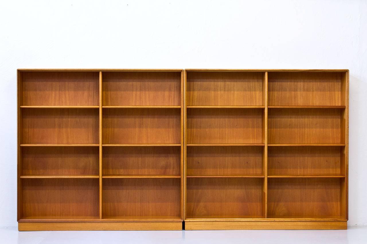 Pair of bookshelves designed by Bertil Fridhagen. Manufactured by Bodafors in Sweden in 1962. Made out of teak with oak edges. Adjustable shelves according to preference.