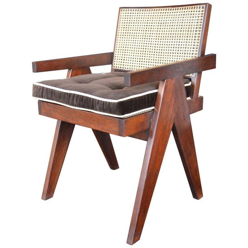 Two teak chairs in the style of Pierre Jeanneret.
