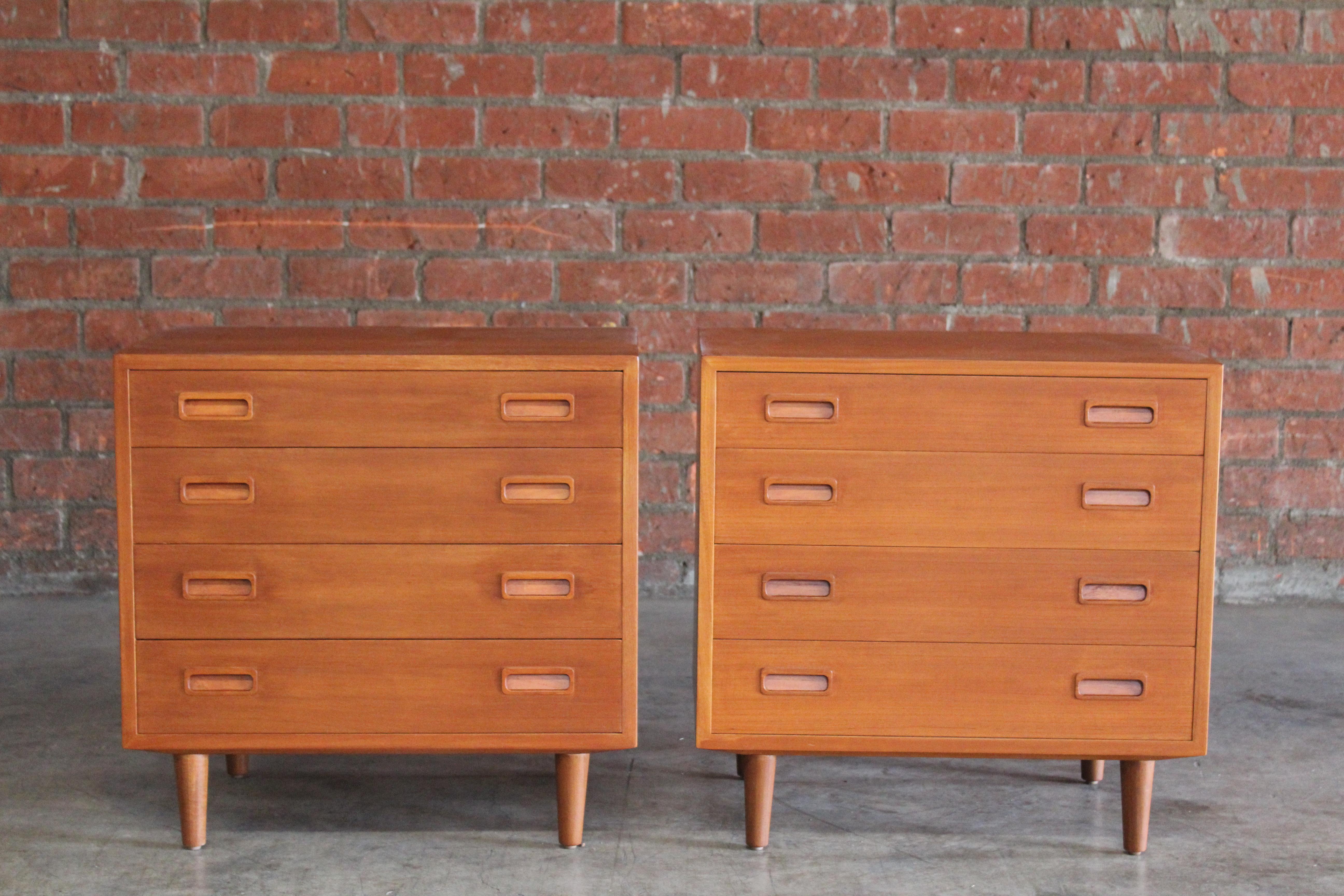 Pair of 1960s Danish teak chests of drawers by Poul Hundevad, 1960s. Perfect for bedside nightstands. The pair have been recently refinished and are in overall wonderful condition. One chest has a small burn mark- please see the detailed photo.