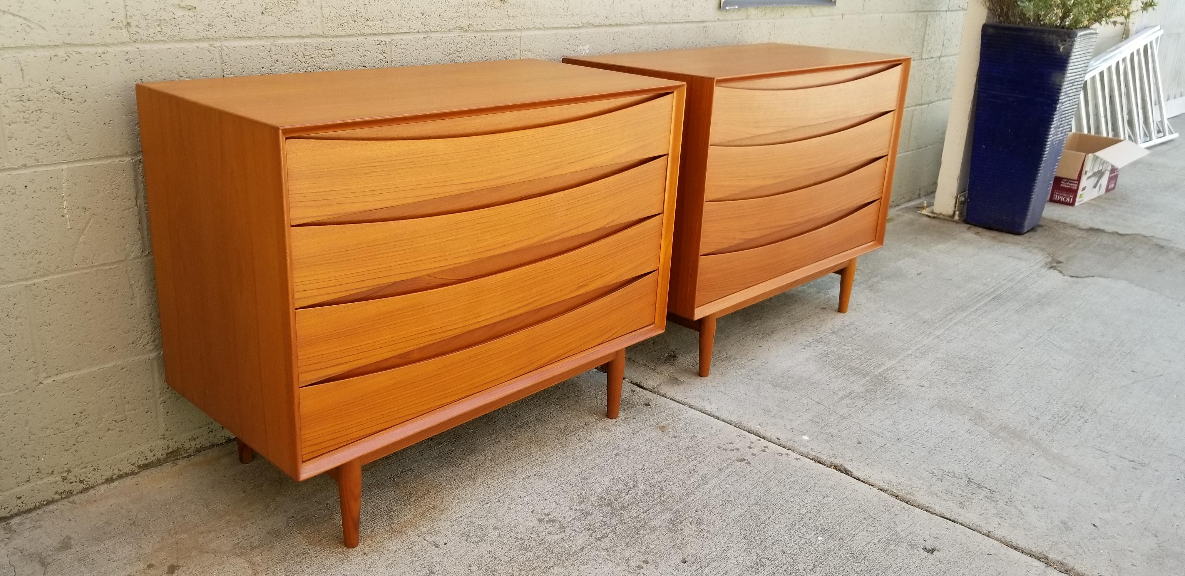 Exceptional matched pair of Danish modern teak dressers designed by Arne Vodder for Sibast. Denmark, circa 1960. Excellent original finish with rich patina. Solid teak drawer fronts. Fitted top drawer with sliding trinket or jewelry tray. All