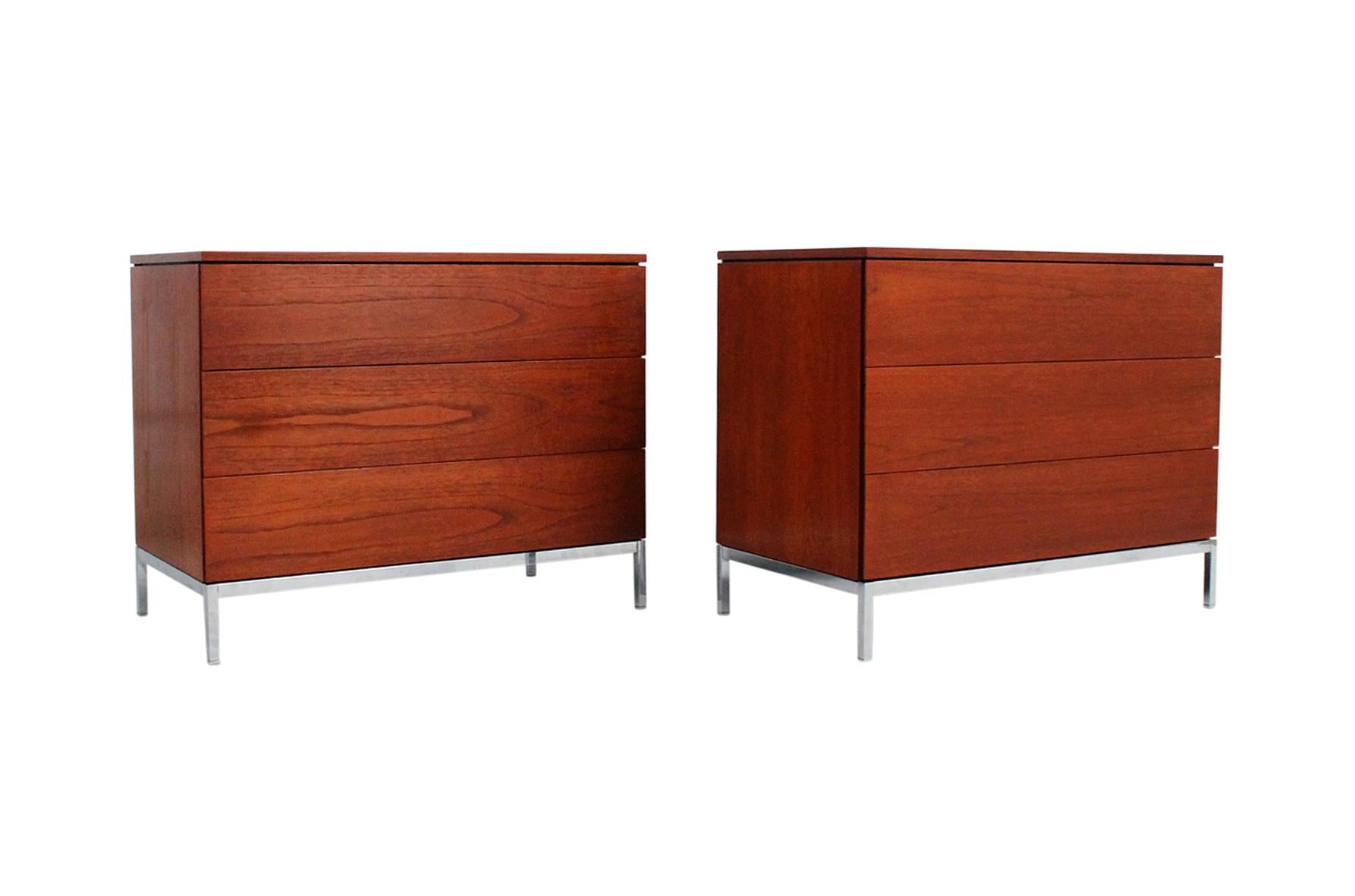 Matched pair of dressers in teak designed by Florence Knoll for Knoll International. Each dresser with three drawers, top drawers with dividers, on chromed steel bases. One dresser with the original Knoll paper label to the underside.