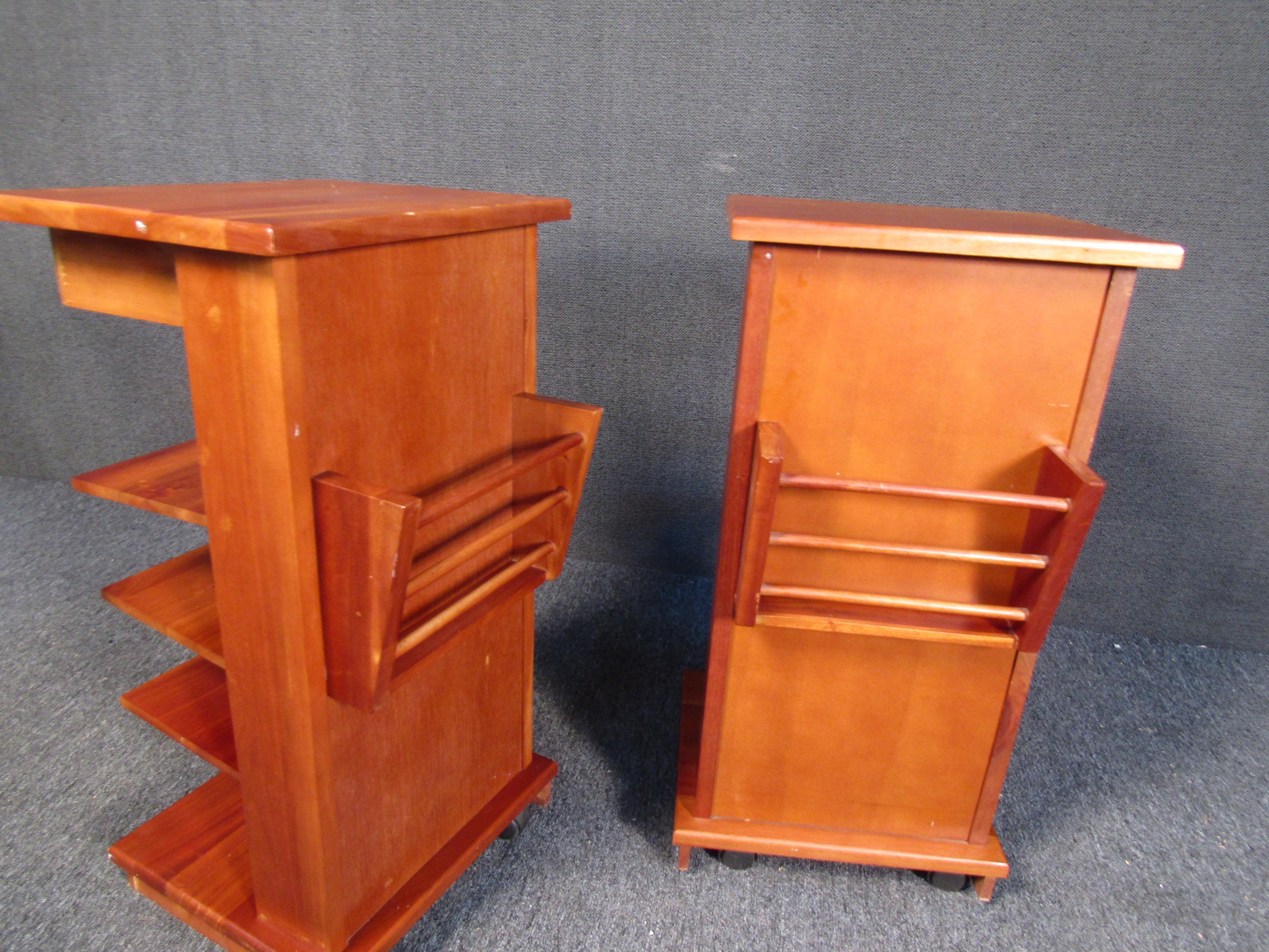With three shelves and a top drawer, each end table in this vintage set offers storage in a timeless Mid-Century Modern design. Please confirm item location with seller (NY/NJ).