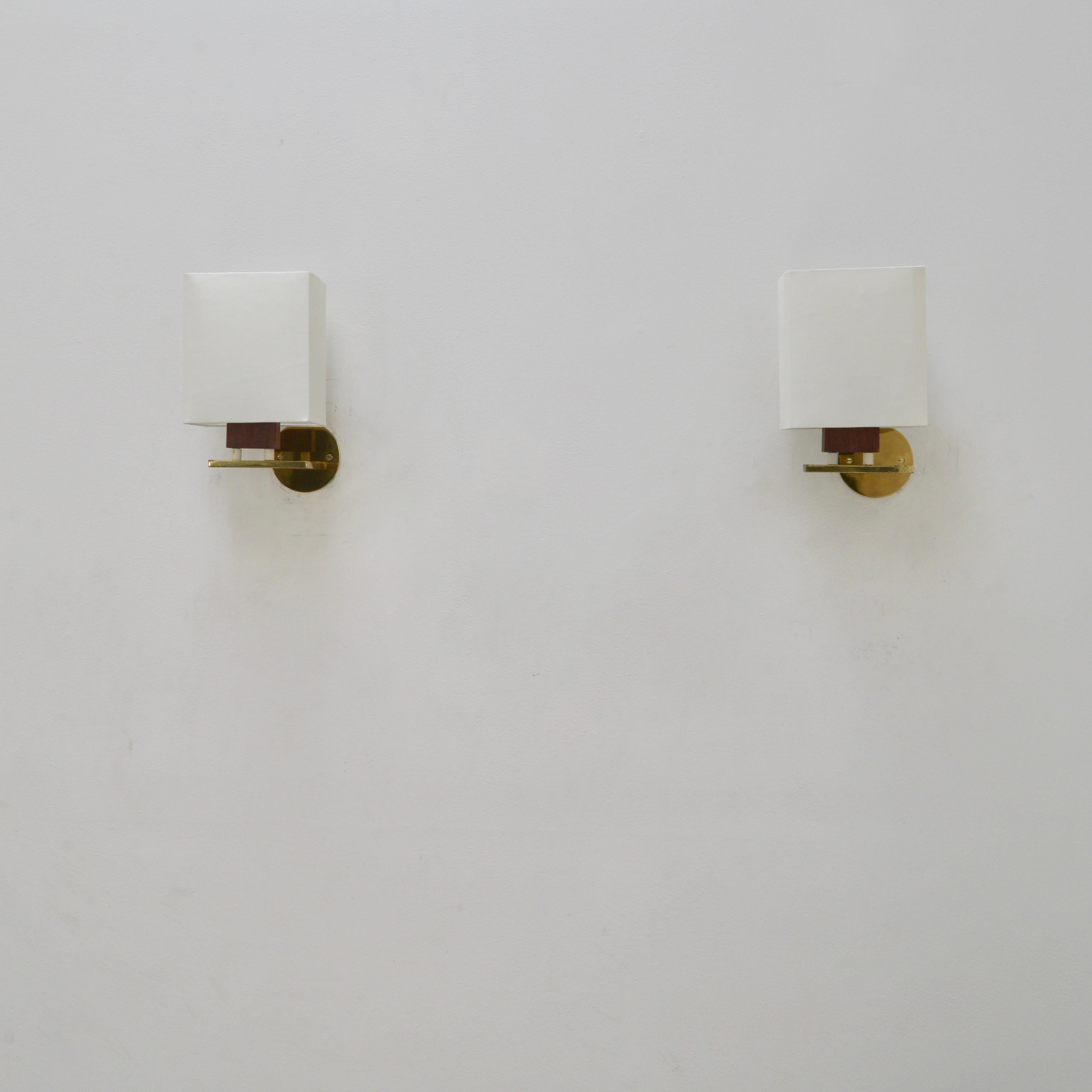 Beautiful Classic Mid-Century Modern teak & fabric Italian sconces from the 50s. (2) E12 candelabra based sockets per sconce. Priced as a pair. Wired for use in the US. Lightbulbs included with order.
Measurements:
Height: 12” 
Depth: 5”
Width: