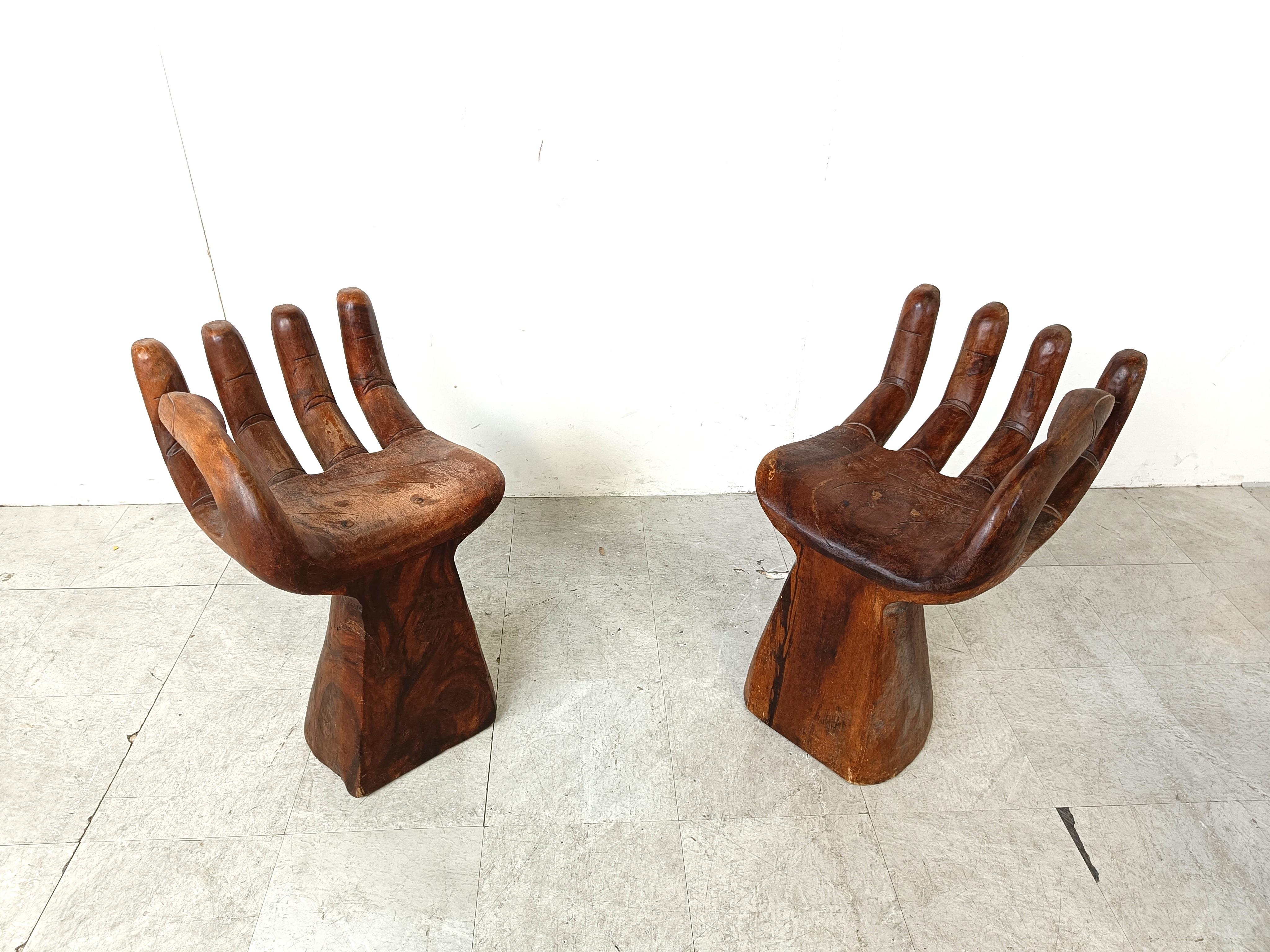 Vintage solid teak wooden sculpted hand chairs.

Beautifully made chairs, very decorative as a pair.

1970s - Asia

Good overall condition

Dimensions:
Height: 68cm
width: 40cm
Depth: 50cm
Seat height: 46cm

Ref.: 201342

*Price is for the pair
