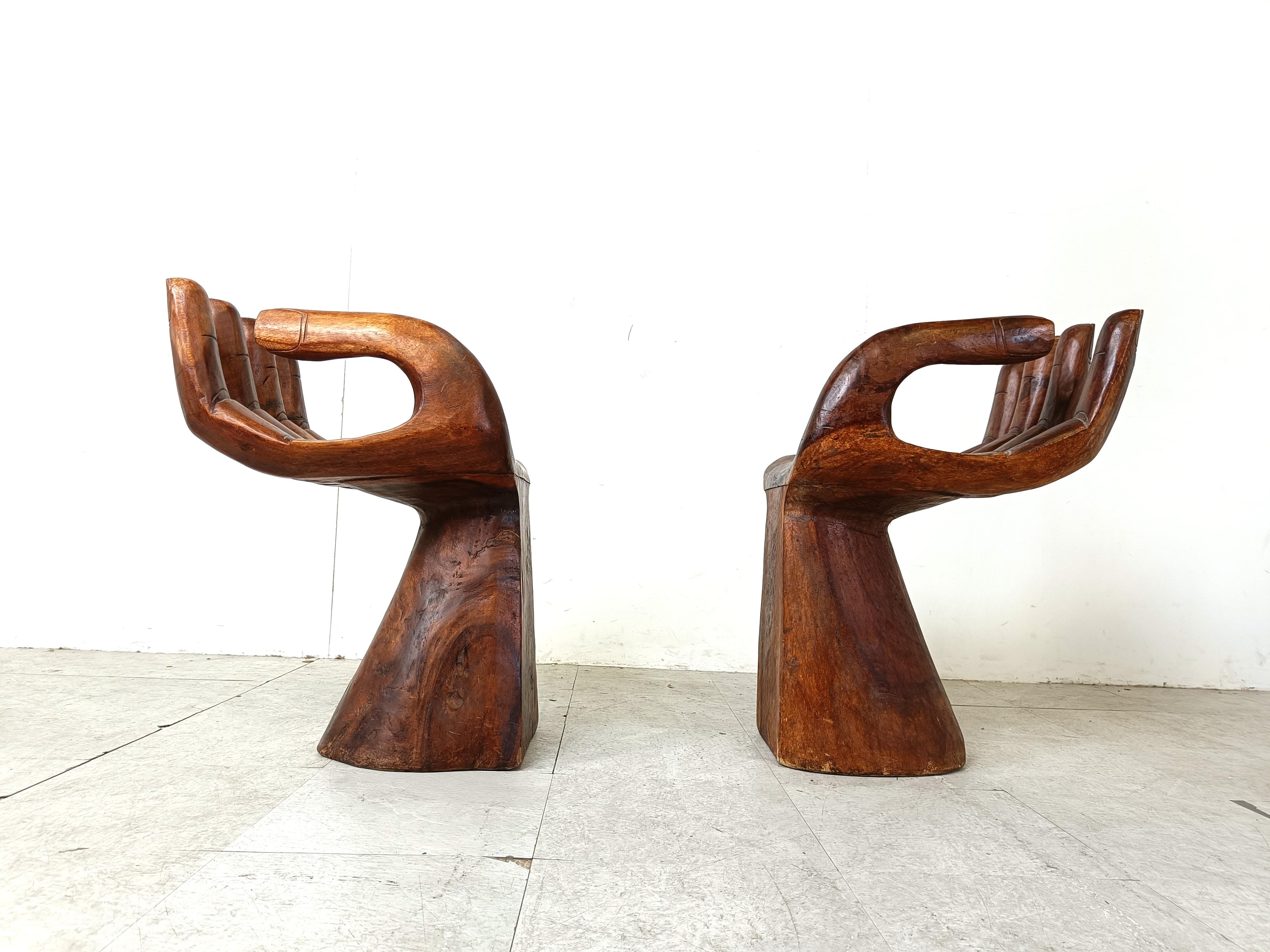 Teak Pair of teak hand shaped chairs, 1970s For Sale