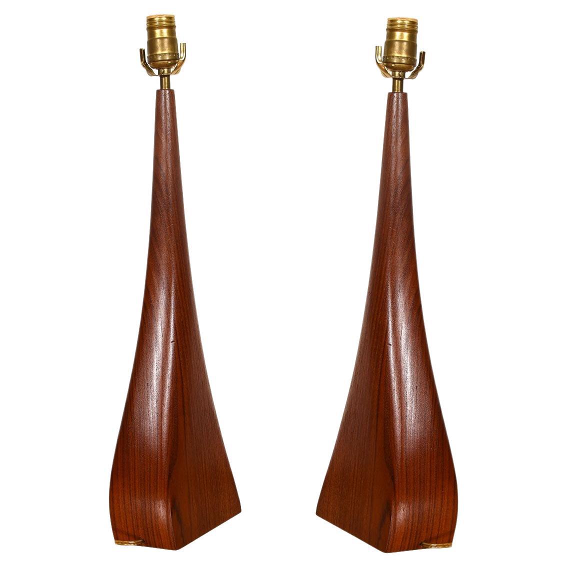 This amazing pair of lamps by Johannes Aasbjerg are biomorphic wedge shapes executed in teak.
Only manufactured for a short time in the early 1960s -- very hard to come by, especially in such a well preserved state.