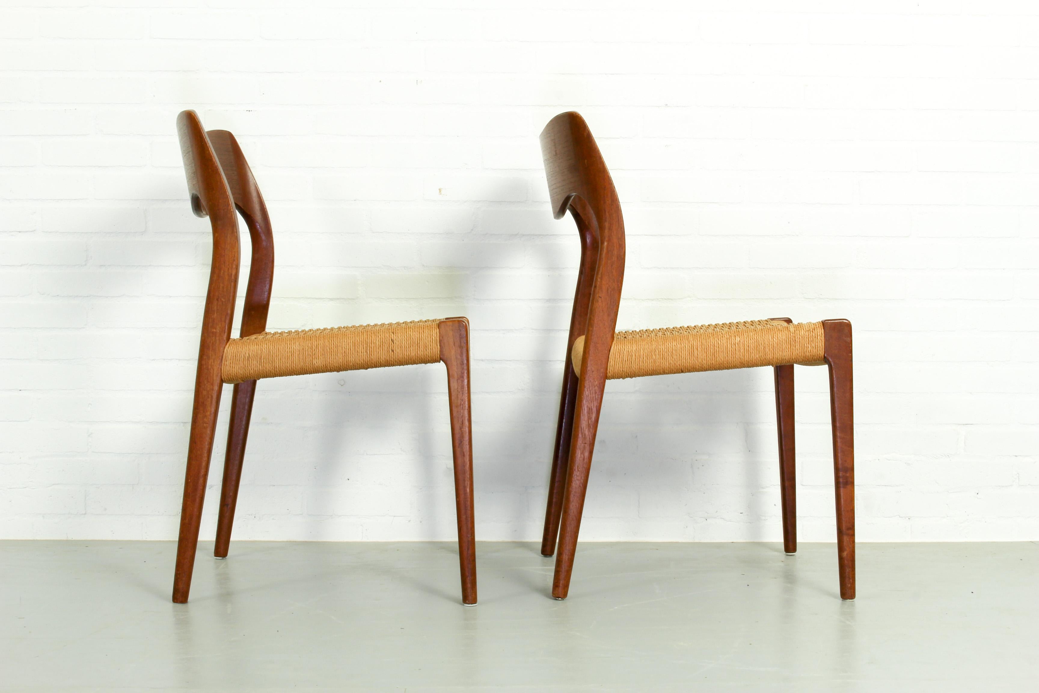 Midcentury design Classic. This set of 2 dining chairs has teak frames and paper cord seating and is in excellent condition.
 