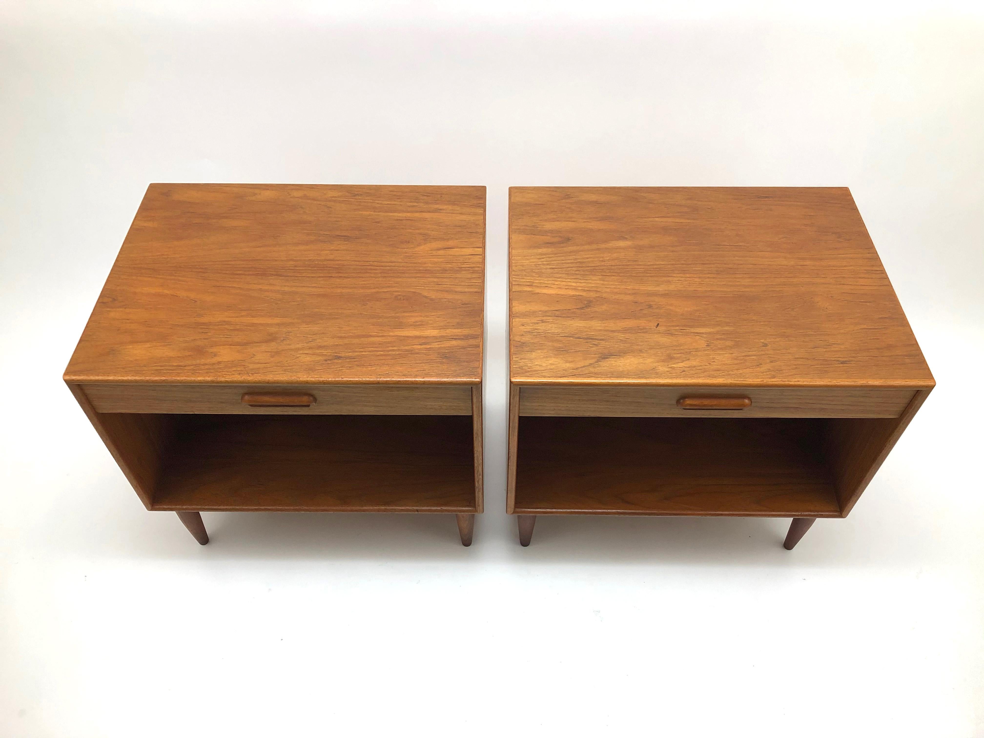 A rare pair of teak night stands by Hans C. Andersen for Gunnar Schwartz.

This handsome duo conveniently has pre-cut portals for bookshelf speaker wires and electronics cords.
   