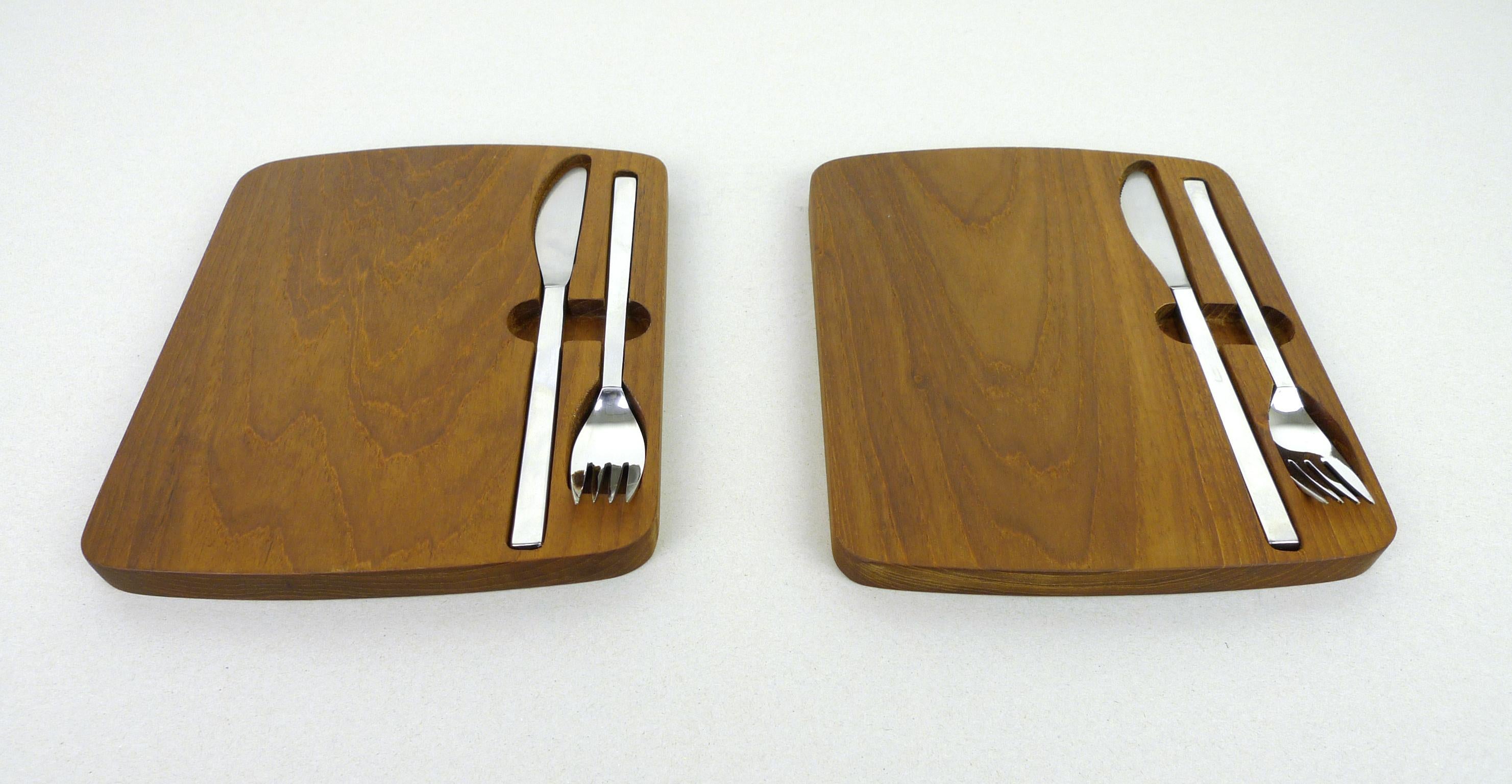 This set of two snack boards made of solid teak wood with inset metal cutlery was made in the 1960s by Bremer Silberwarenfabrik AG. The set is in very good condition.