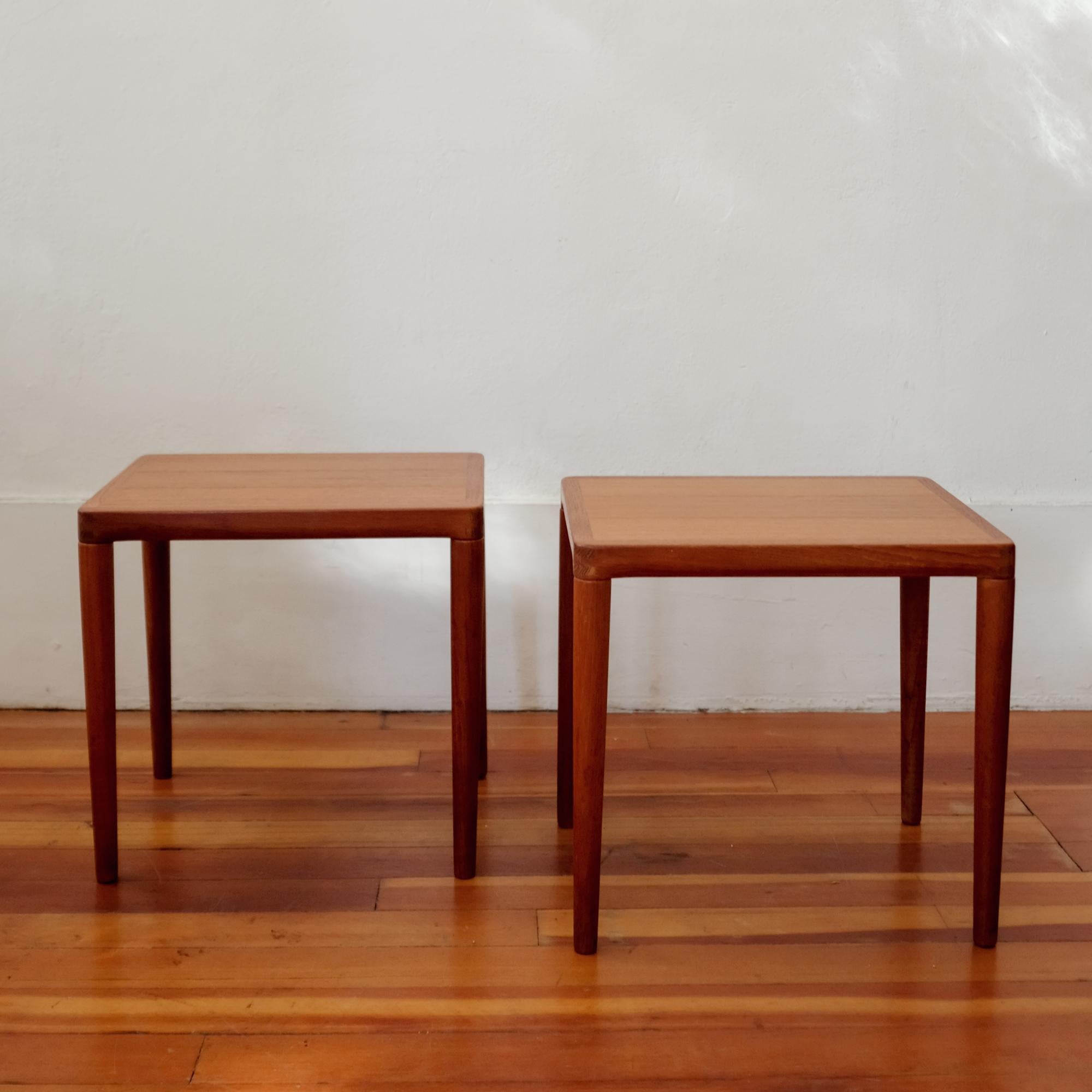 Pair of teak occasional tables by Norwegian designer Henry Walter (H.W.) Klein. Fantastic details and joinery on these small scale tables.

In the late 1940s Klein moved to Denmark. While there, he studied interior design at the Tekniske Skile in