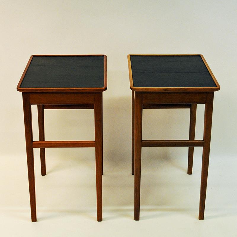 A pair of lovely vintage long legged side or small tables of beaded birch with a leather top surface made by Bodafors, Sweden in the 1950s. Perfect as small tables, side tables, night tables or put together as a coffee table. The tables has a little