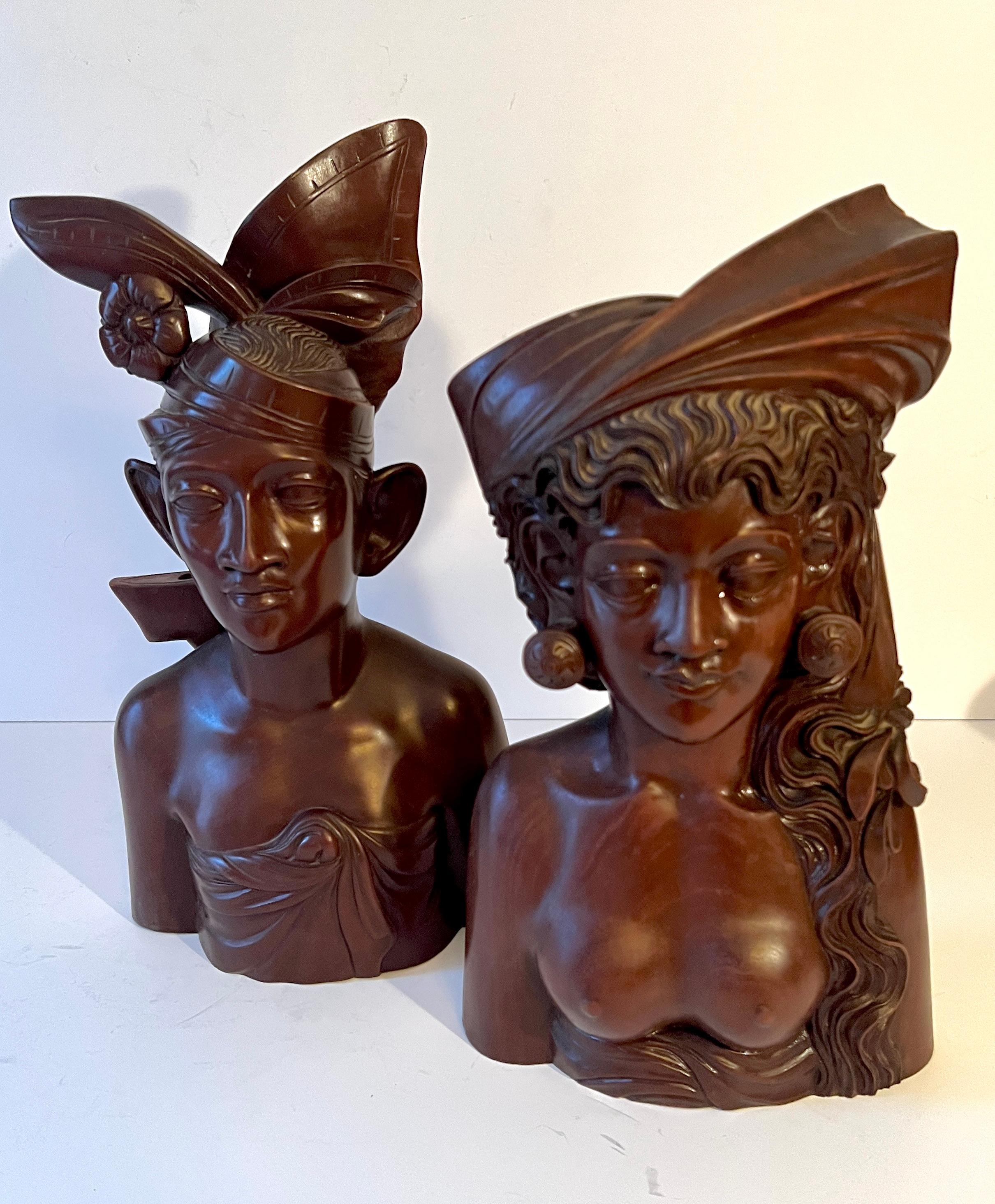 Pair of Hand Carved Signed Balinese figure bookends or sculptures - two outstanding carved wood figures - both intricately carved.  The pair are lovely island people and can work as a stand alone piece (s), or work very well as bookends for large
