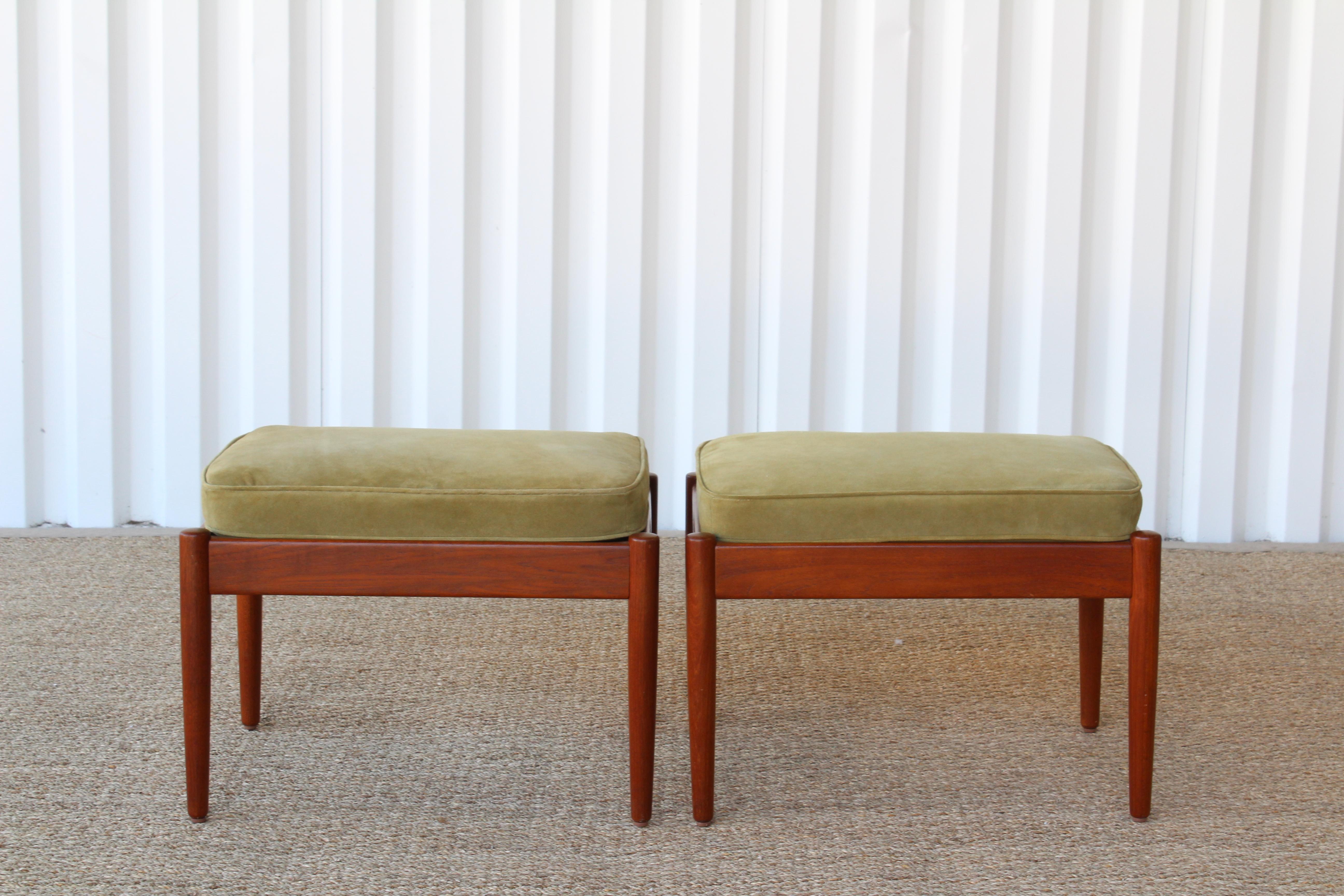 Pair of 1960s Danish teak stools with new green suede loose cushions. Teak frames have been refinished.