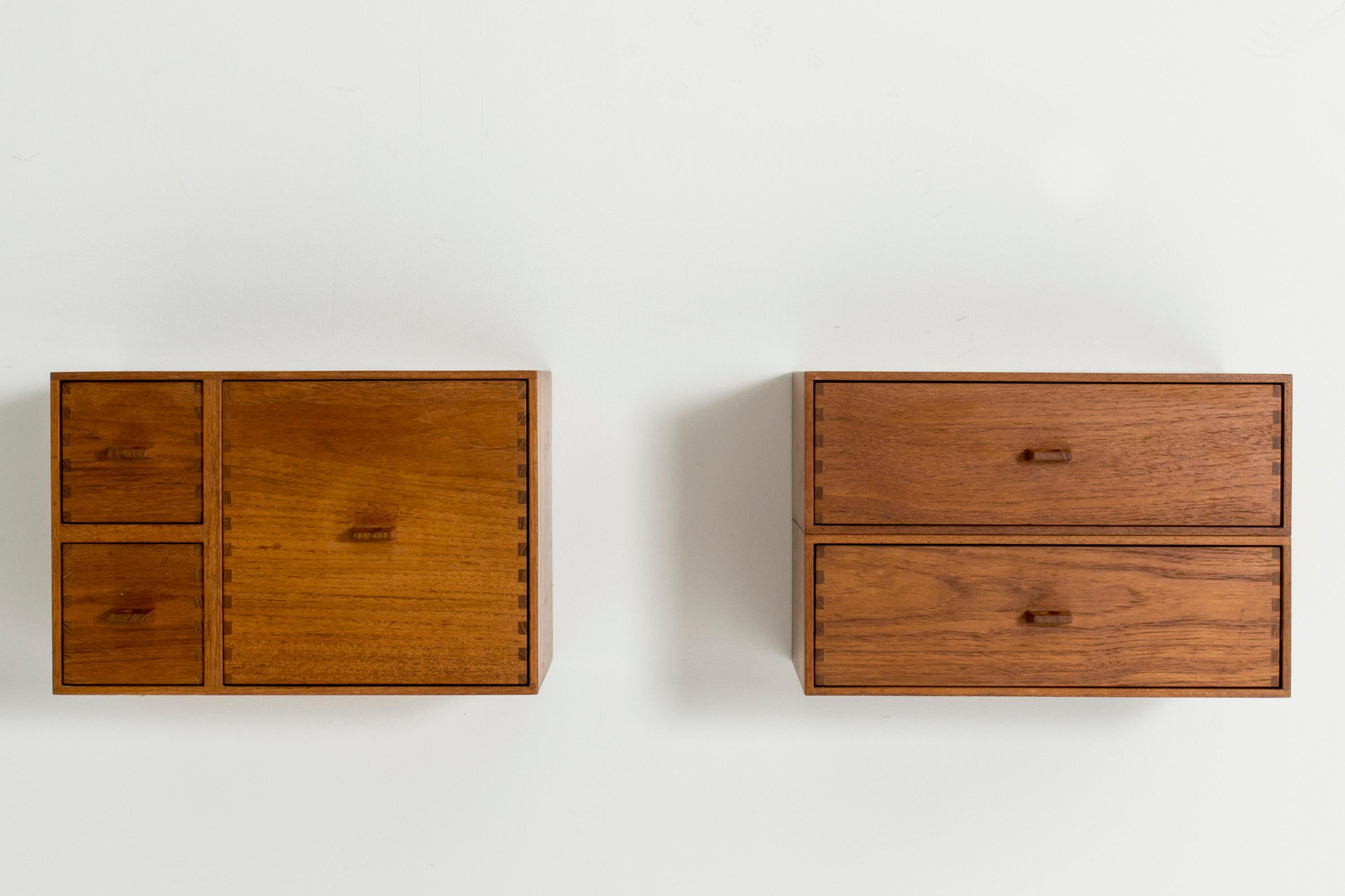 Pair of wall-mounted shelves by Uno and Östen Kristiansson, made from teak. One has two drawers, the other three. Perfect as bedside tables. Cool proportions, beautiful handles and decorative joinery in the corners.