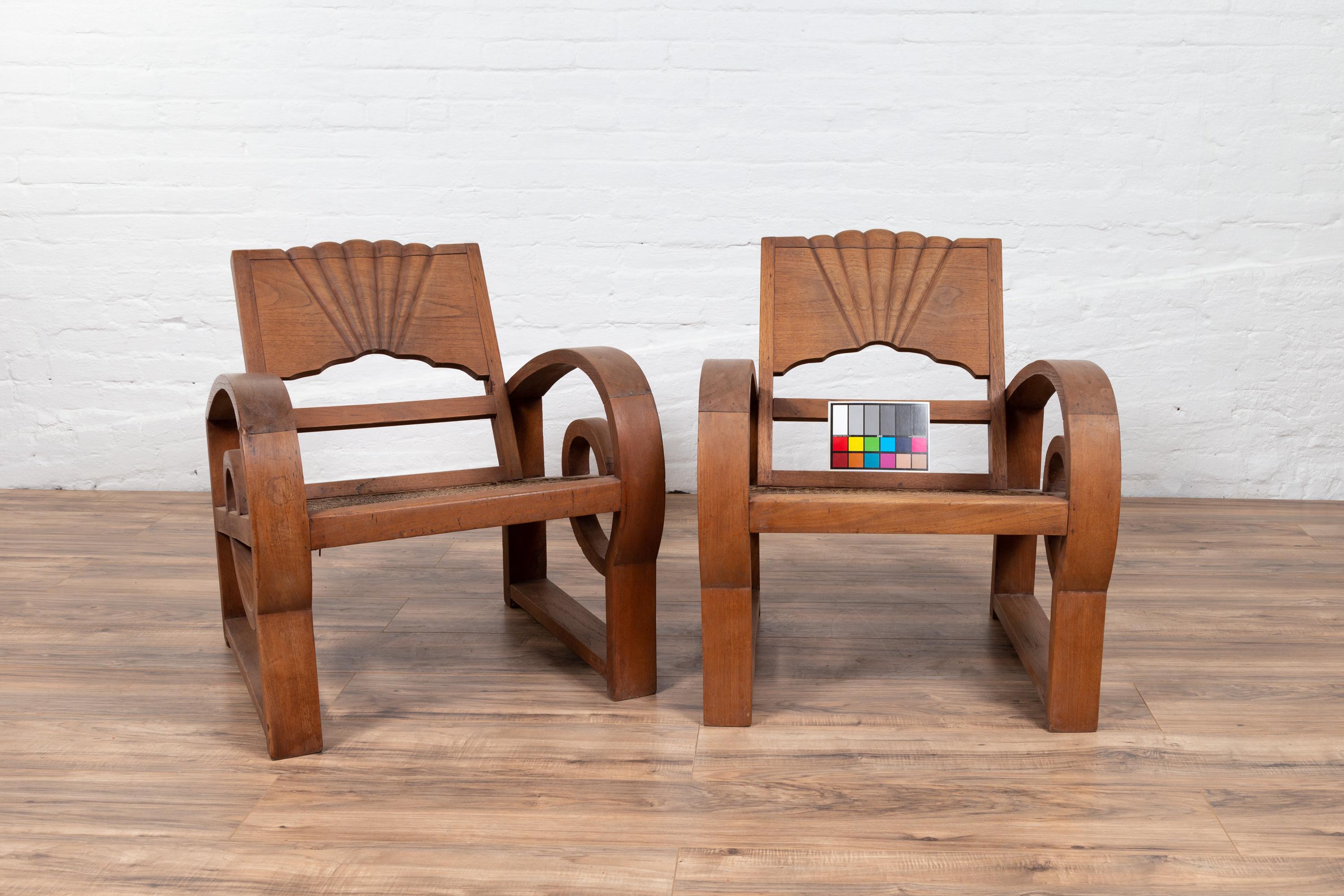 Pair of Teak Wood Country Chairs from Madura with Rattan Seats and Looping Arms 10