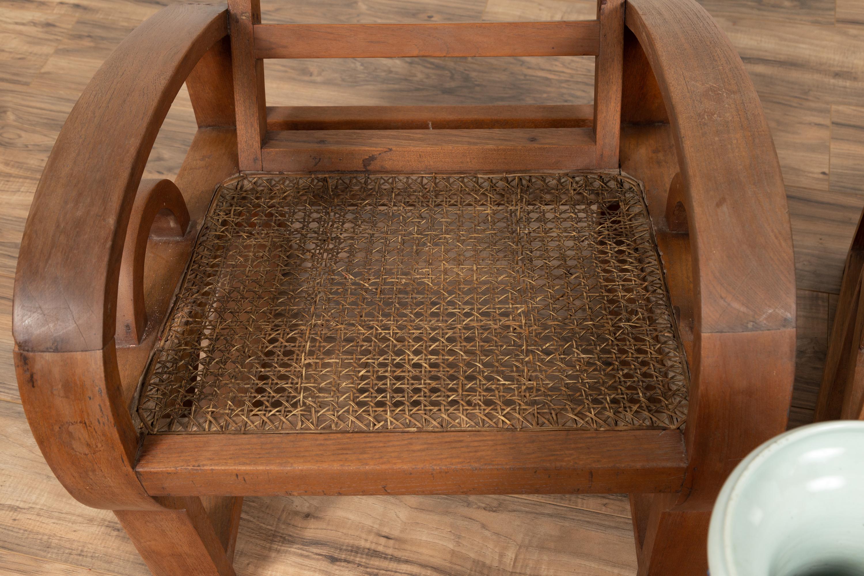 Pair of Teak Wood Country Chairs from Madura with Rattan Seats and Looping Arms 12