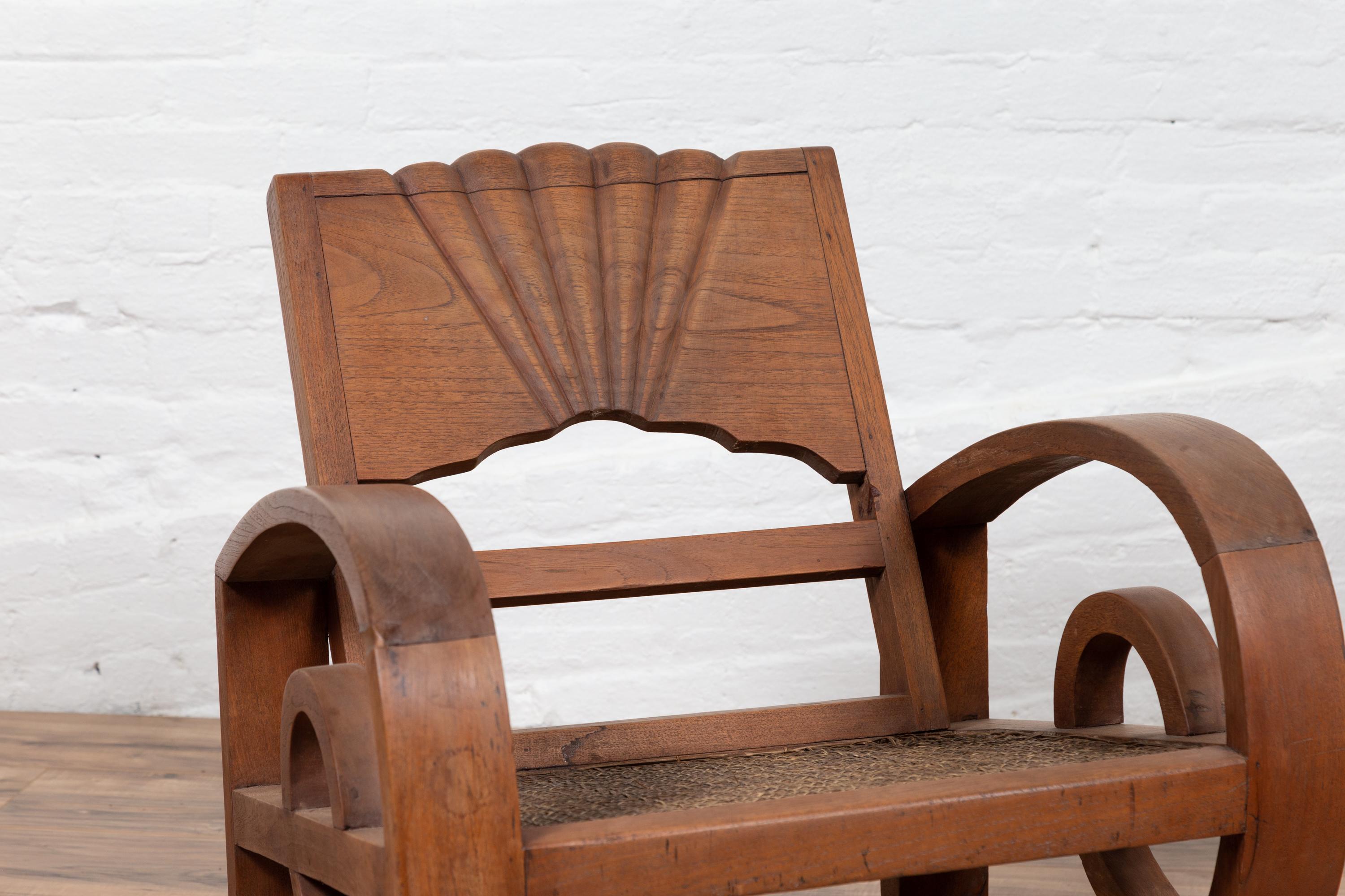 Indonesian Pair of Teak Wood Country Chairs from Madura with Rattan Seats and Looping Arms
