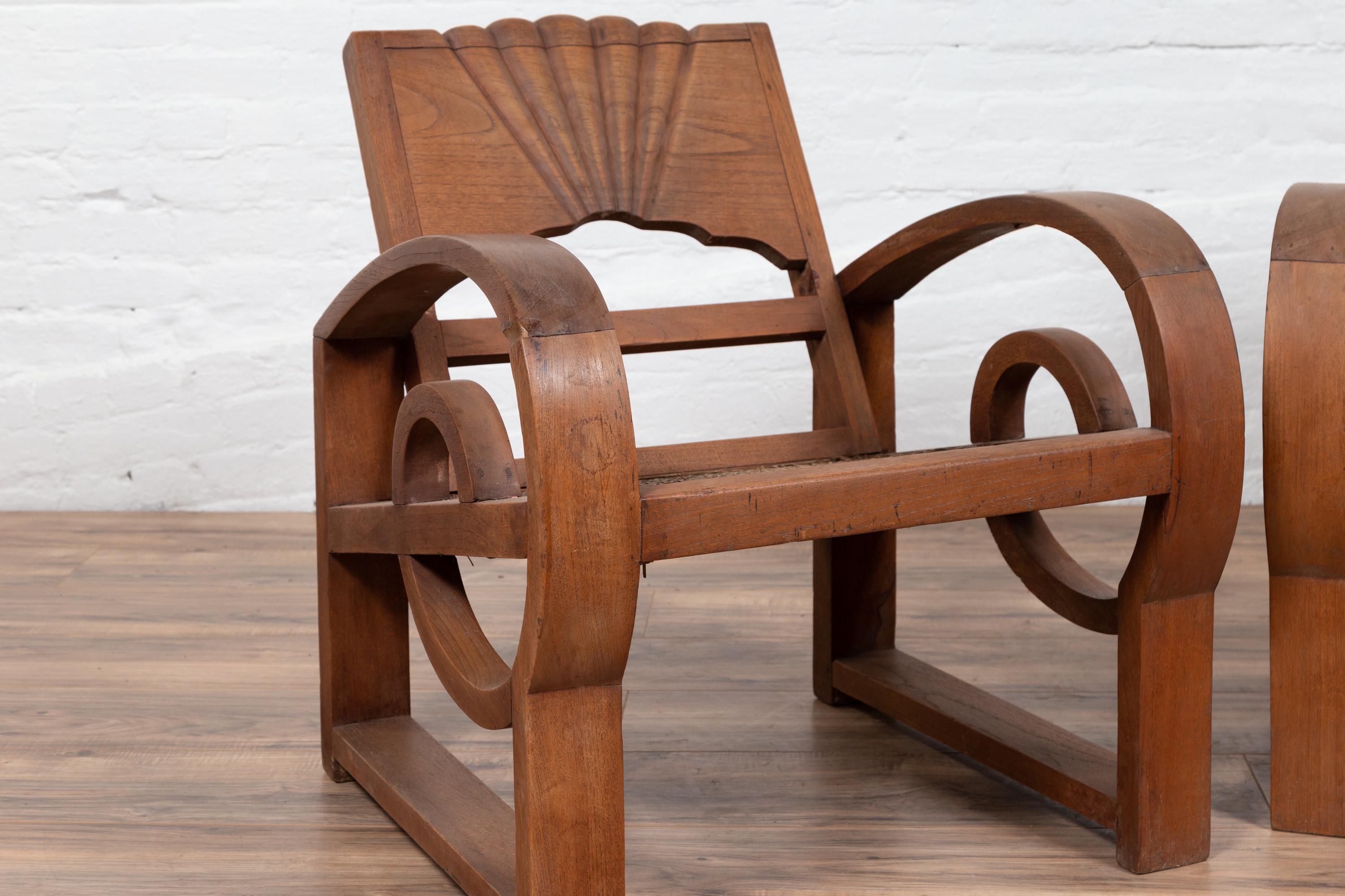 Pair of Teak Wood Country Chairs from Madura with Rattan Seats and Looping Arms In Good Condition In Yonkers, NY
