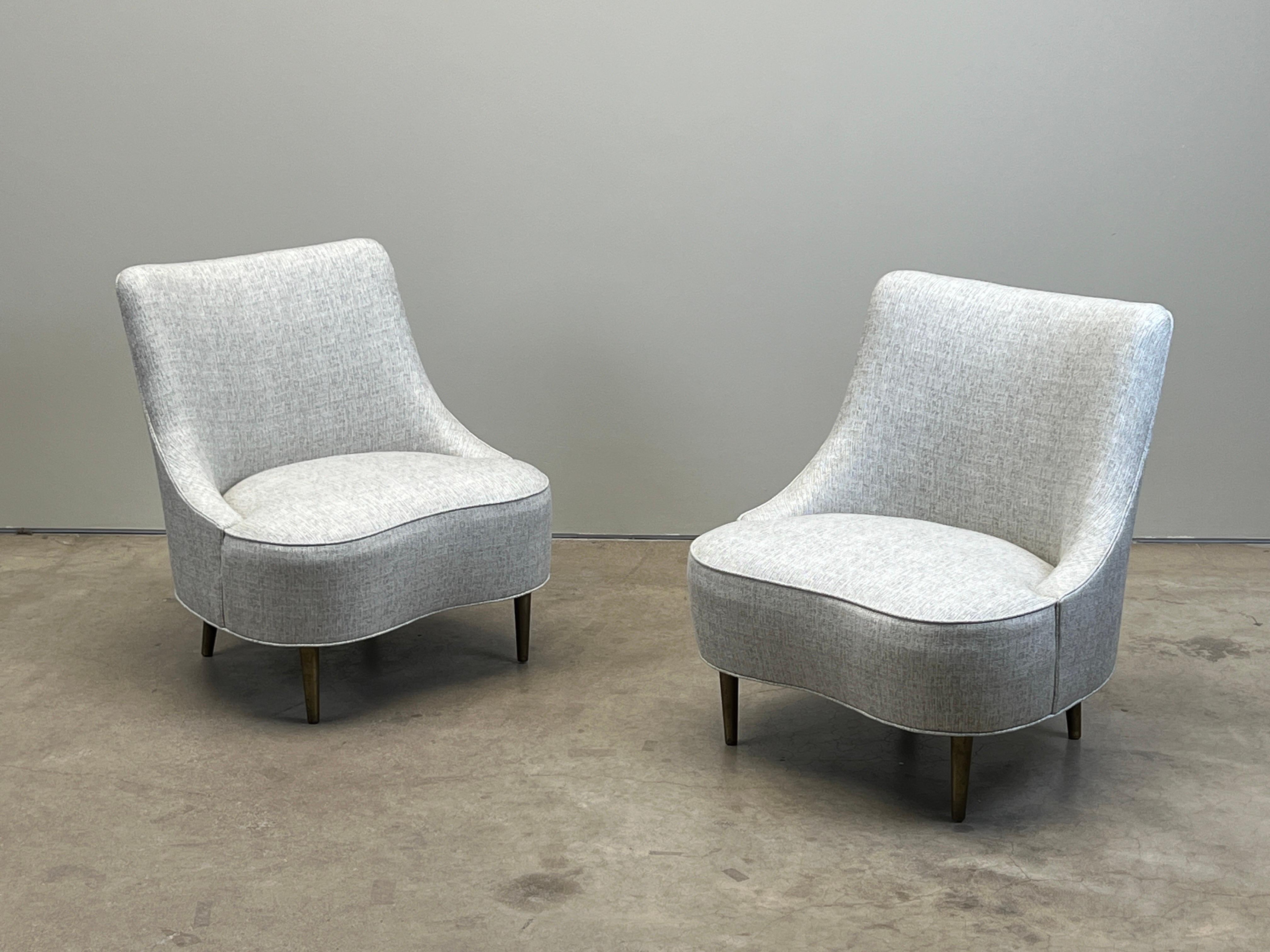 A pair of tear drop slipper chairs on brass legs. Designed by Edward Wormley for Dunbar. Reupholstered in Holly Hunt / Nova / Celestial. 

Two pairs available. 