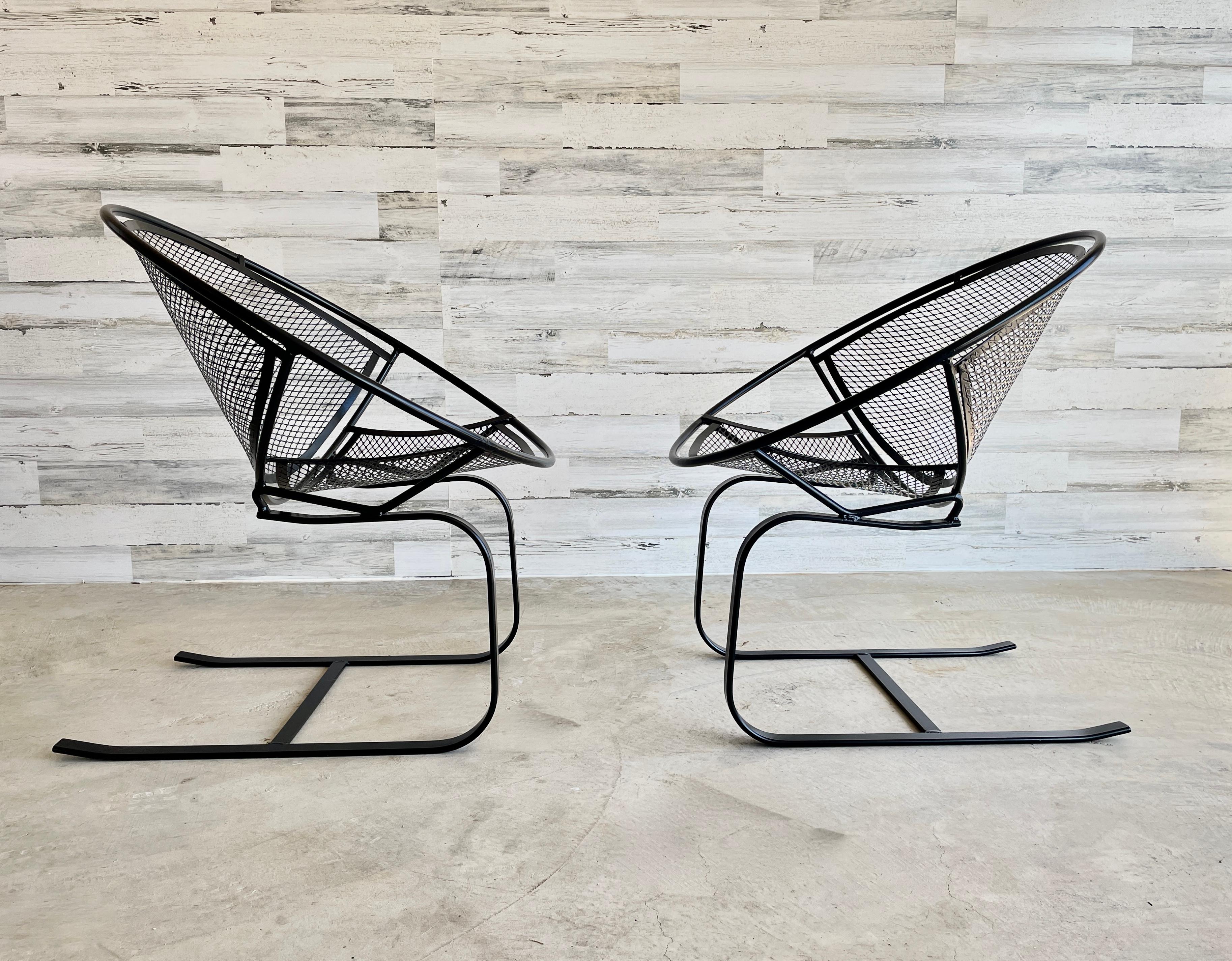 Vintage cantilevered Patio lounge chairs designed by Maurizio Tempestini for Salterini.
Professionally powder coated in satin black . 

Tete a tete and coffee table not included at this price.