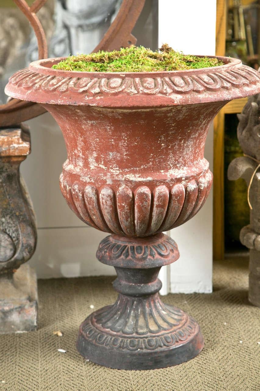 Campana style urns with egg and dart pattern.