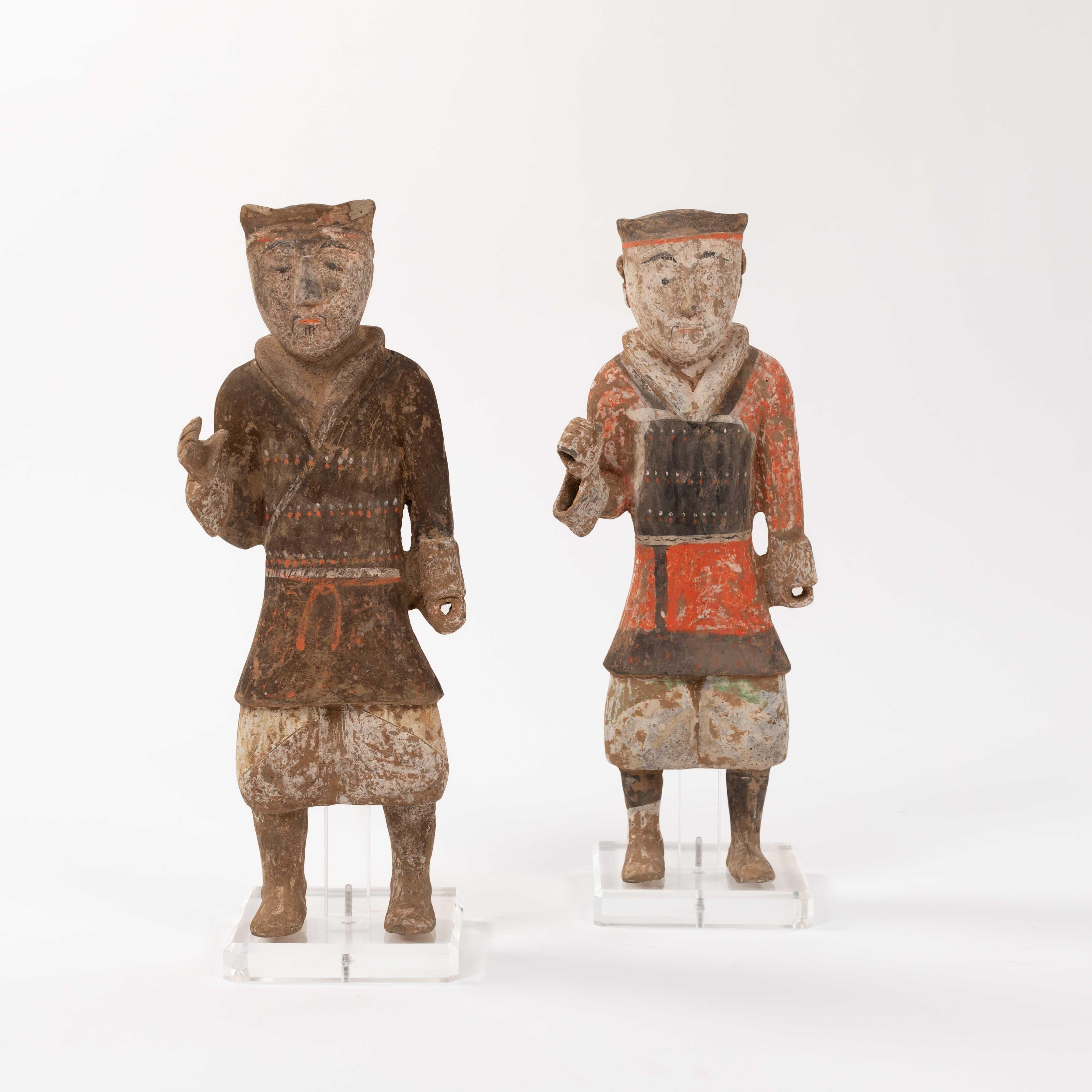 Pair of terracotta Han guardsmen in polychrome paint China TL tested 

Pair of rare standing male terracotta sculptures/warriors of the Chinese Han dynasty from the 2nd century BC.
With current (04.11.2024) 15 page certificate per object from the