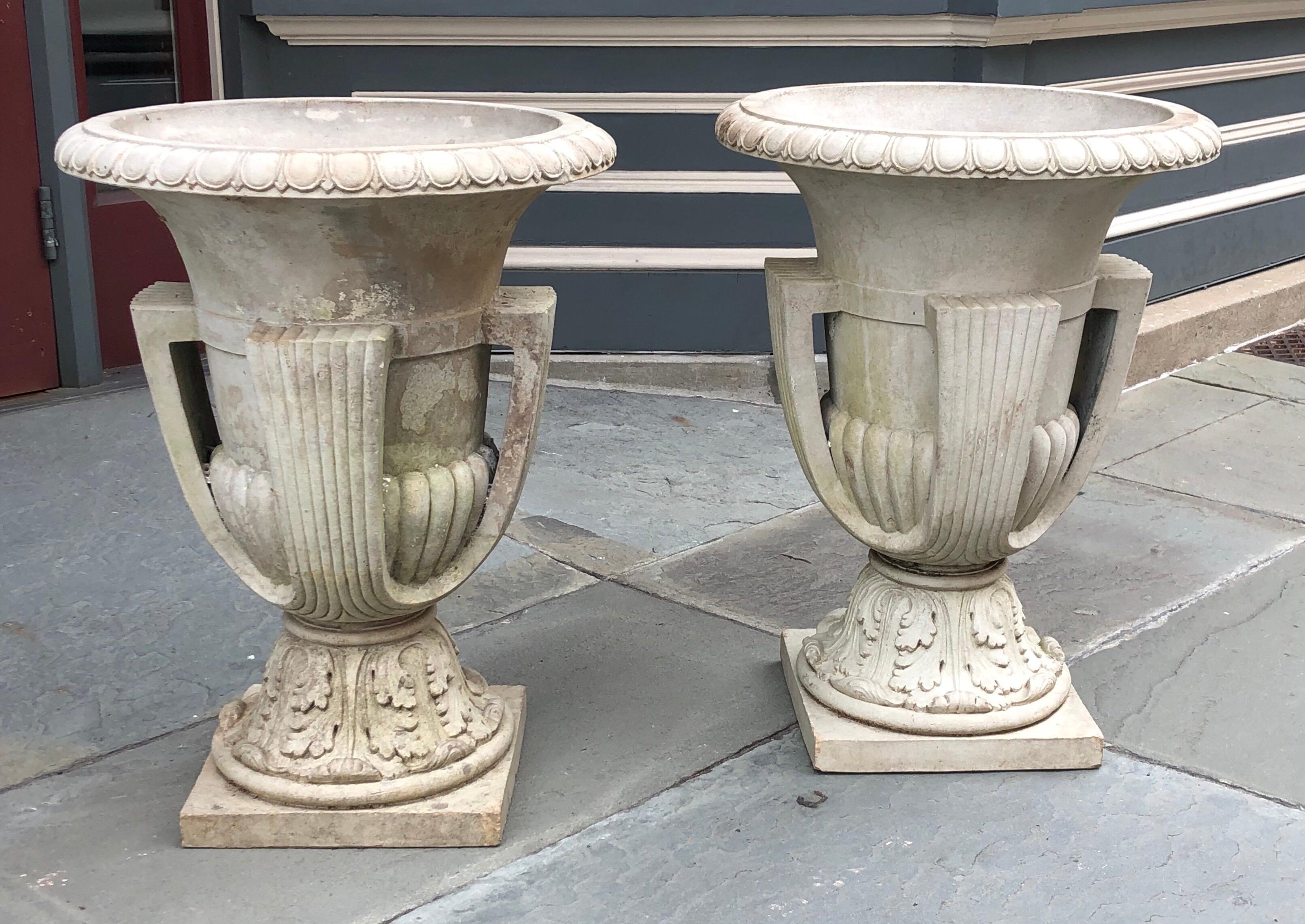Amazing pair of grand scale deco terracotta glazed urns, with both urns being signed 