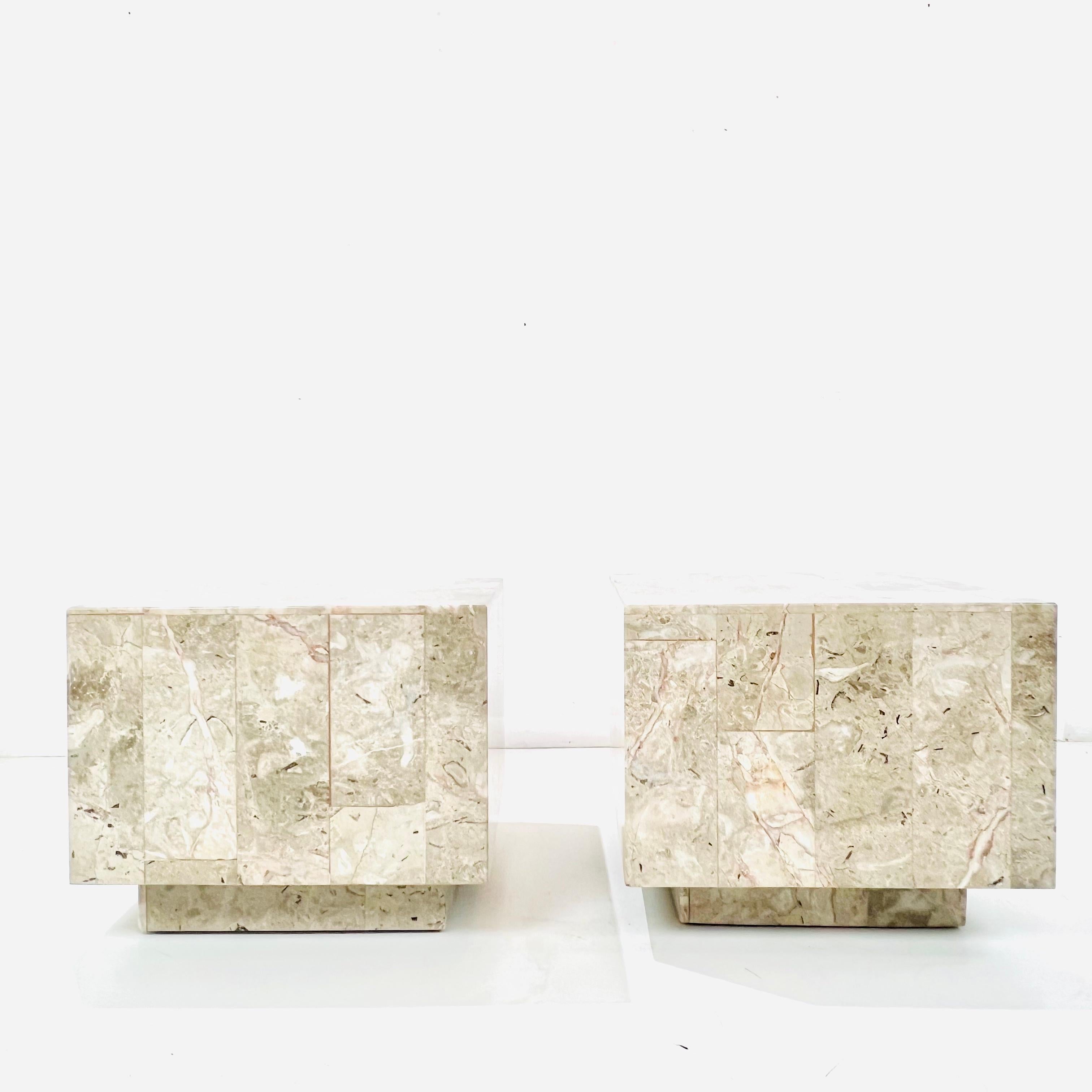 Chic pair of modern quartzite side/end tables. Stone plinth bases support quartzite slabs around hollow base with interior metal frame. Good condition with some chips to stone at base and on one top edge (see photos for details).
