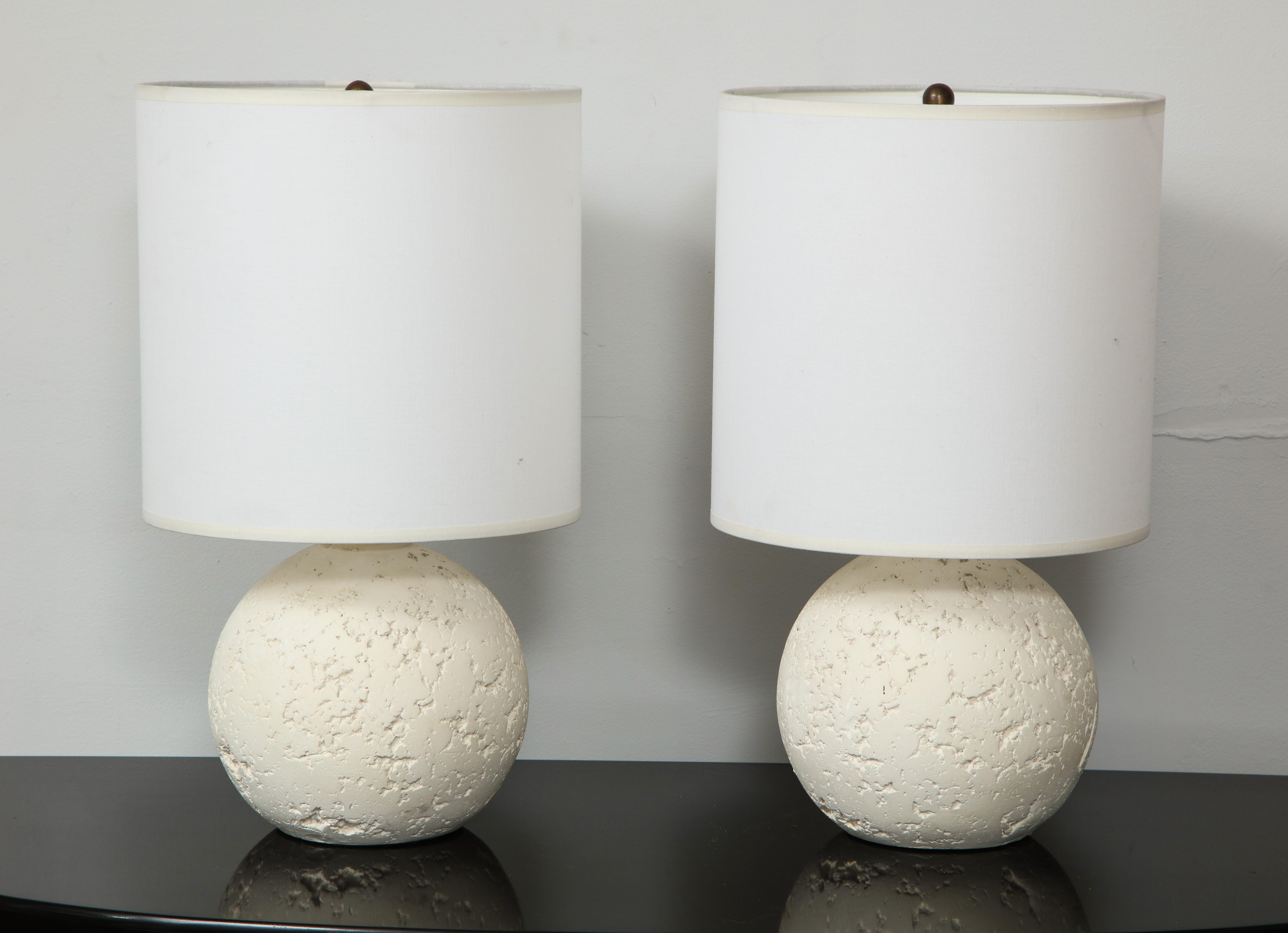 Pair of textured custom circular plaster lamps.