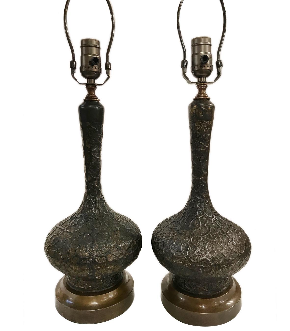 A pair of unique circa 1940s French patinated textured metal table lamps with original finish.

Measurements:
Height of body 14.5