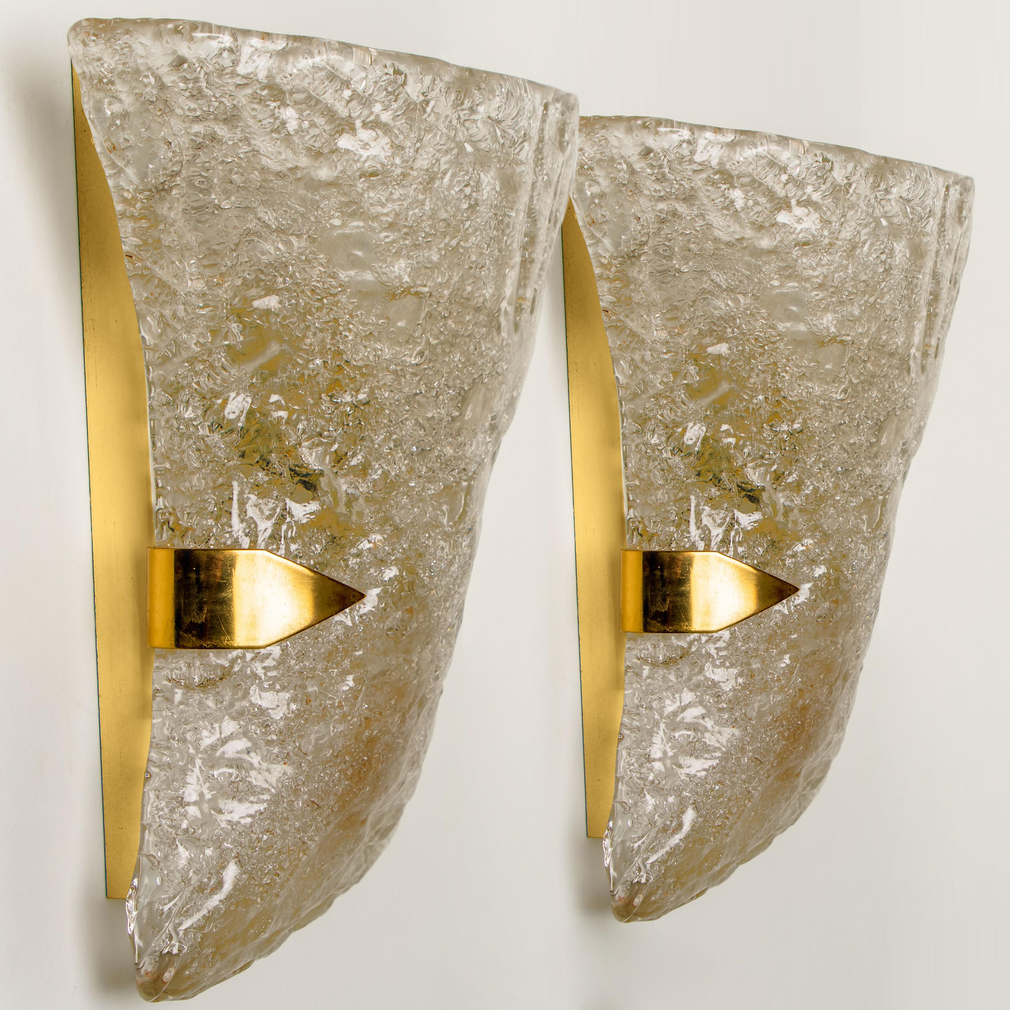 Beautiful diabolo shaped wall lights by Hillebrand. Manufactured in midcentury, circa 1970 (late 1960s or early 1970s).
Wonderful light effect due to lovely glass elements

In very good vintage condition. Each light requires 2X E14 light bulbs up