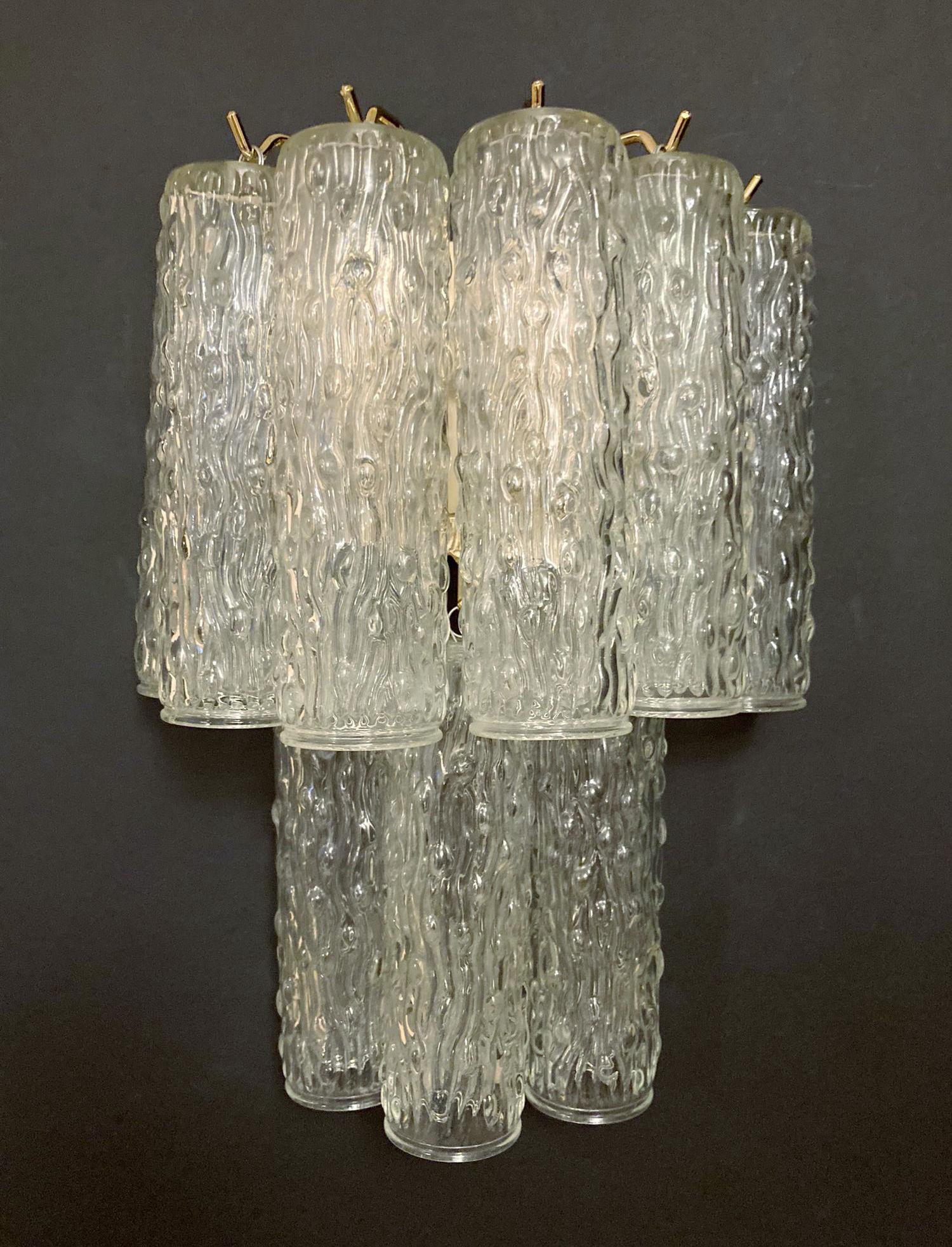 Pair of Italian wall lights with vintage textured Murano glass tubes mounted on newly made gold finish metal frames / Made in Italy
2 Lights / G9 type / max 40W each
Height 14.5 inches, width: 10 inches, depth: 6 inches
2 pairs in stock in Italy,