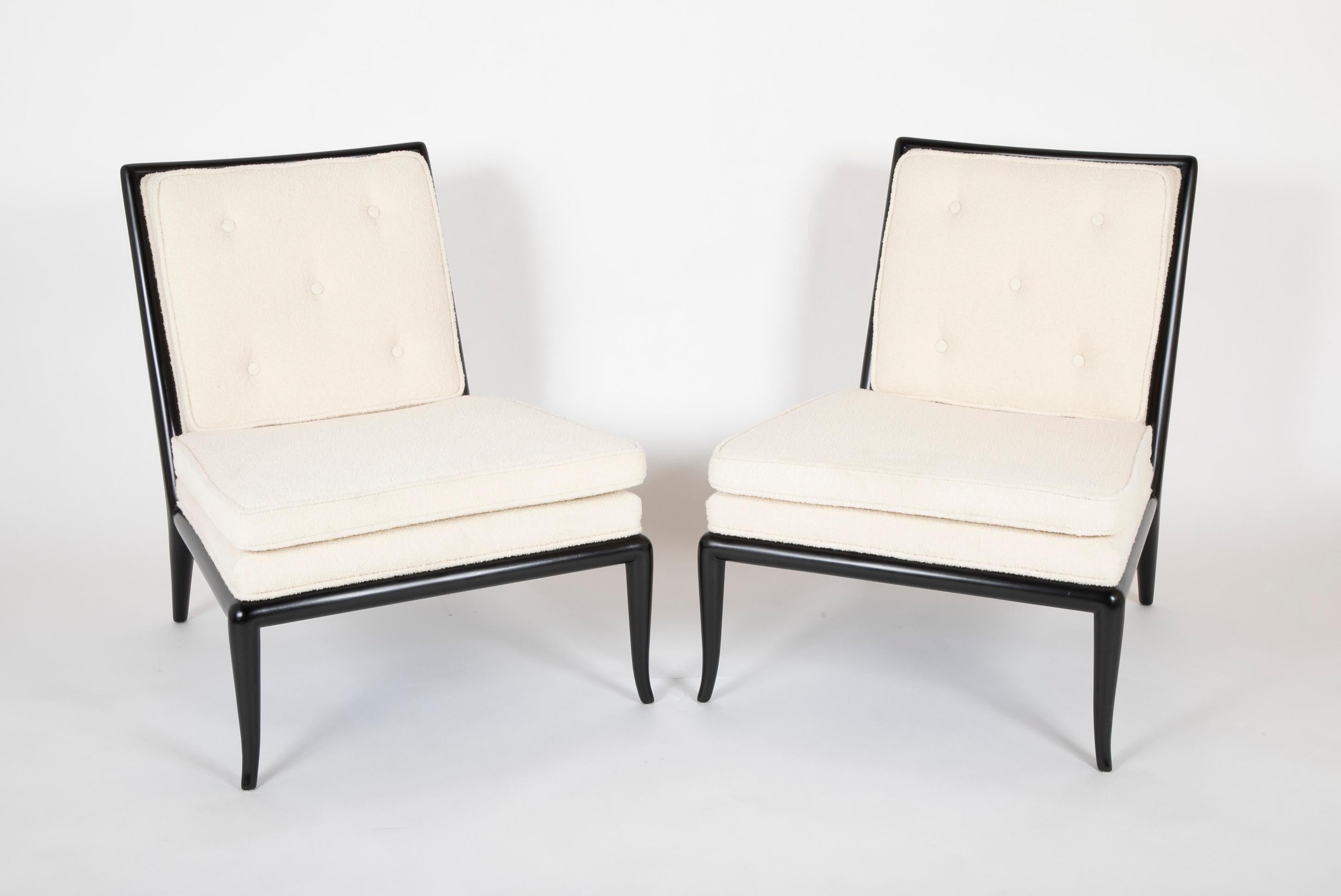 Pair of T.H Robsjohn-Gibbings for Widdicomb slipper chairs with ebonized flared legs. Upholstered seat and cushion, circa 1950s.