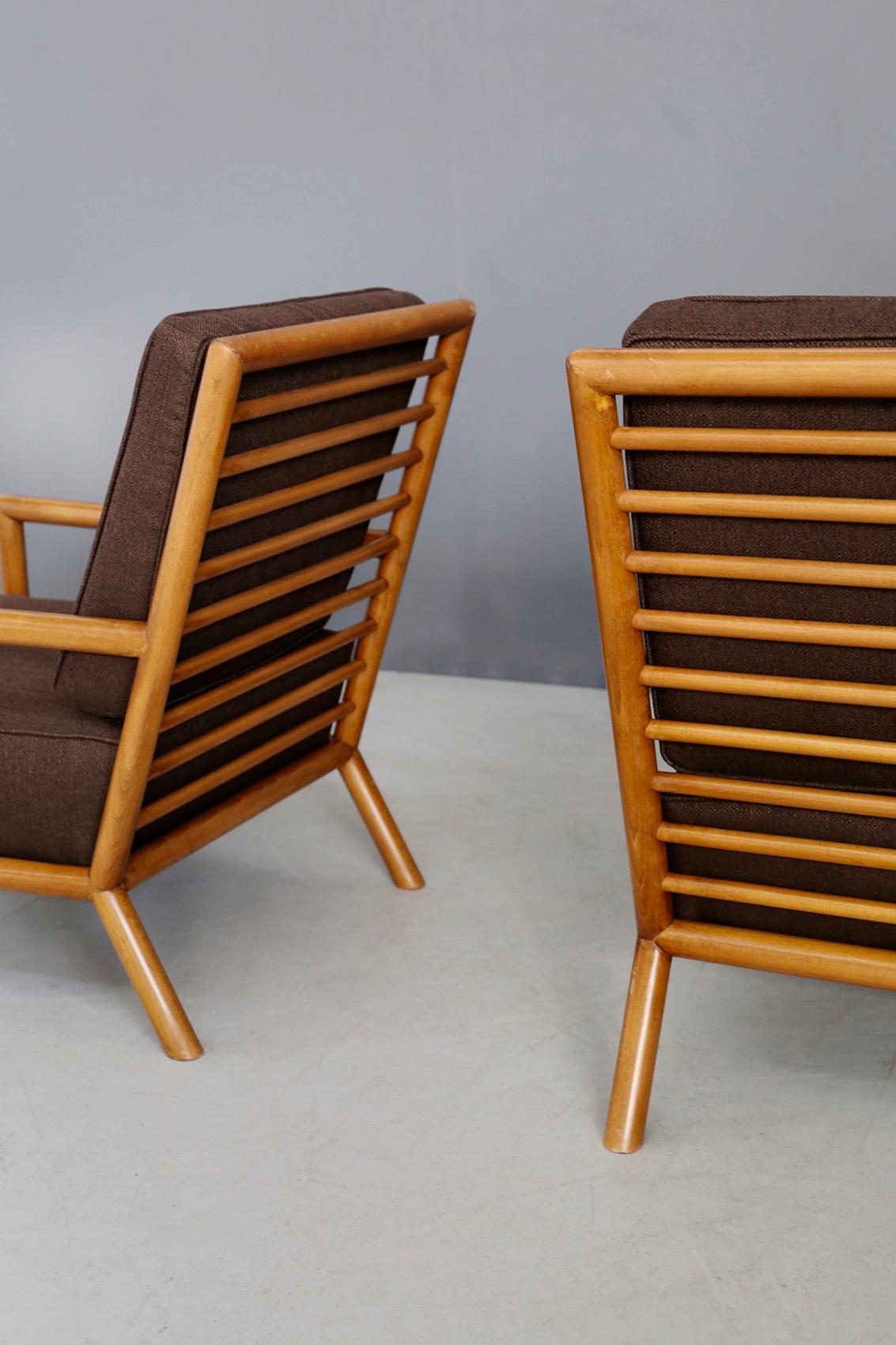 Rare pair of armchairs designed by T.H. Robsjohn-Gibbings in 1950. The armchairs are made of light walnut and have been restored. The backrest is made of tubular wooden slats to make the seat much more solid and comfortable. Its very linear and