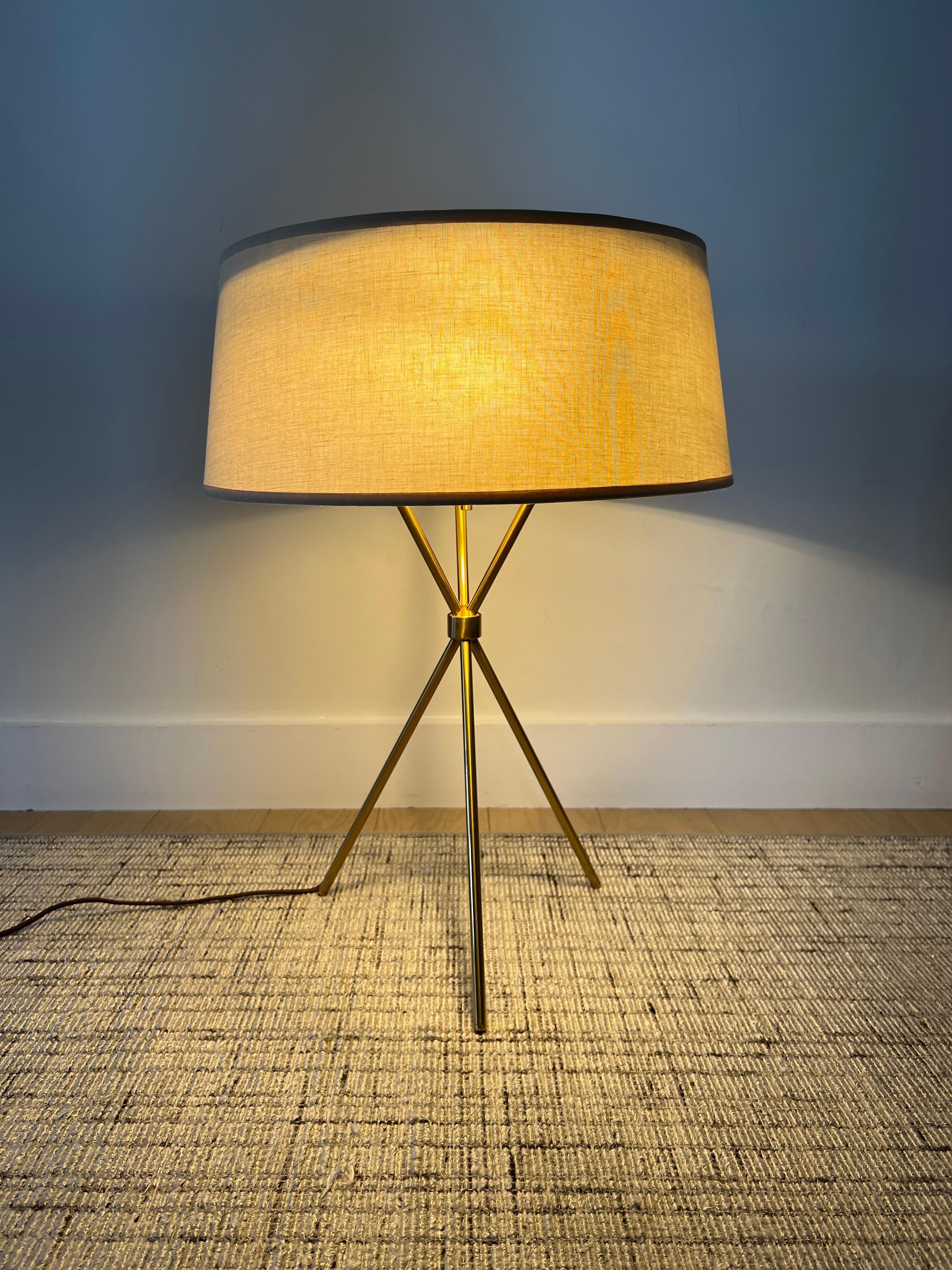 T.H. Robsjohn-Gibbings for Hansen Lighting brass tripod table lamp Model 170 with shade, enameled metal diffuser, three light sockets with pull chains.
Base: 10.5